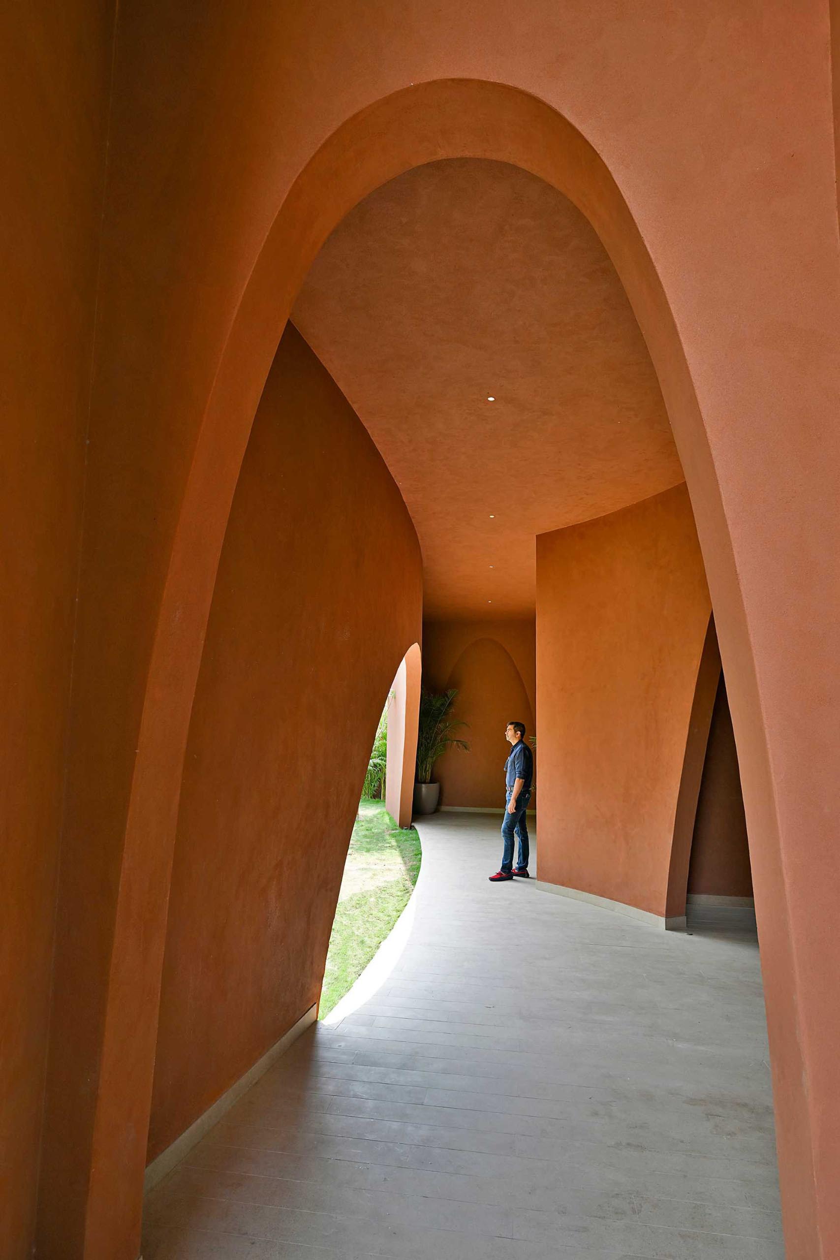 A covered outdoor patio with arch accents.