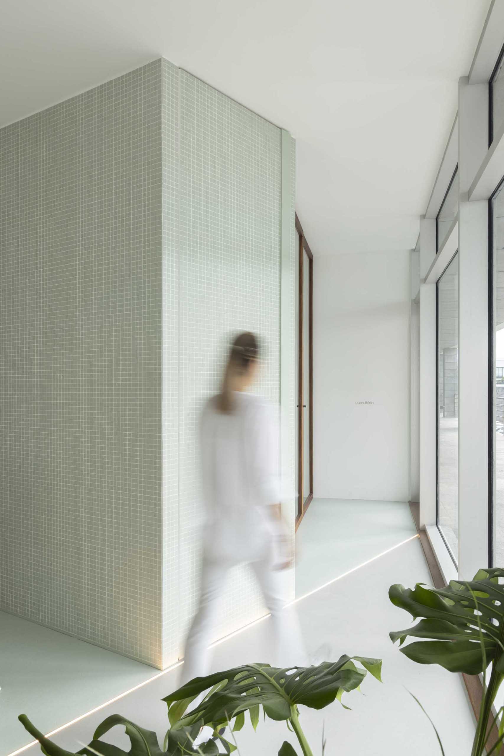 A modern health clinic with pastel green accents.