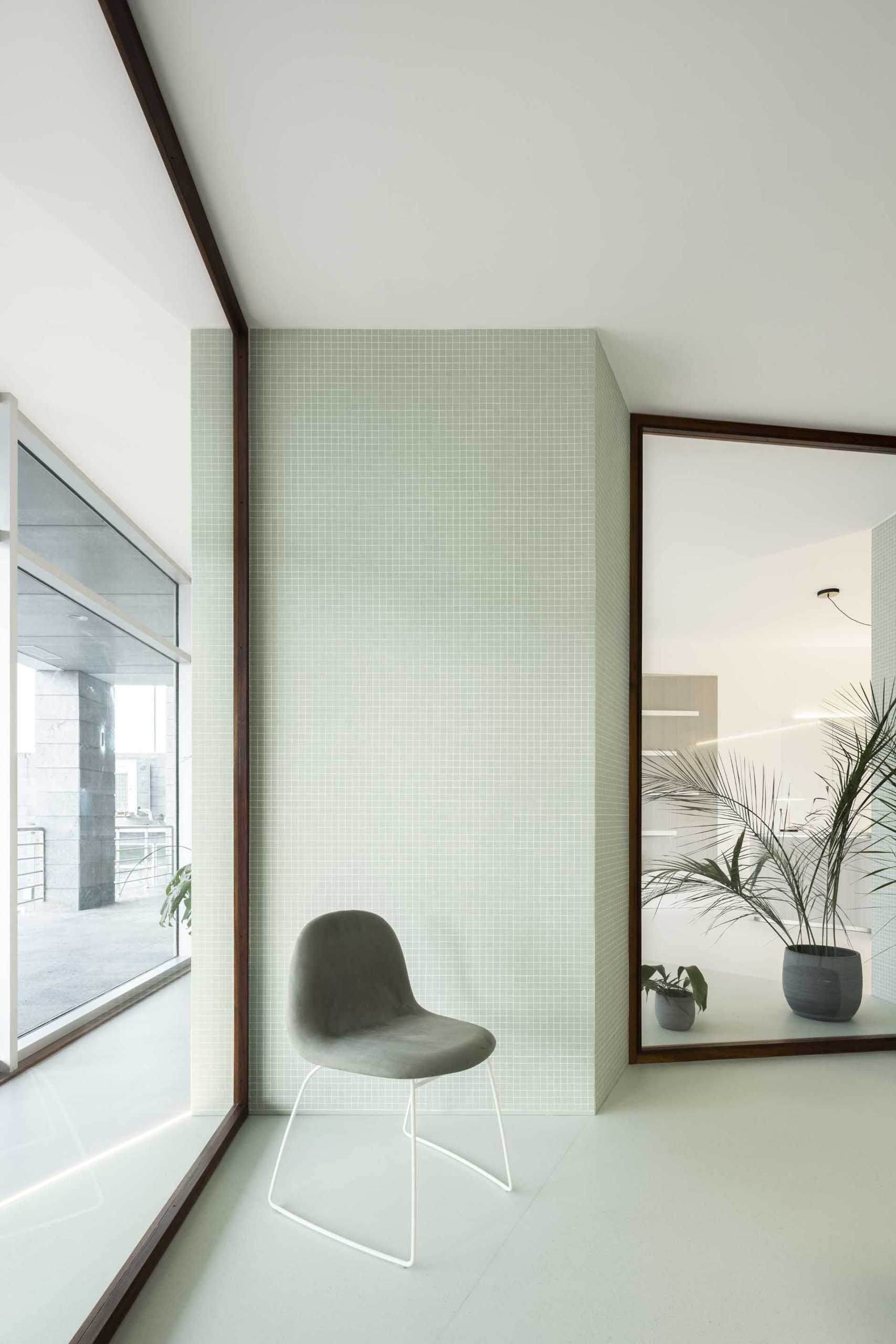 Pastel green tile walls in a modern health clinic.