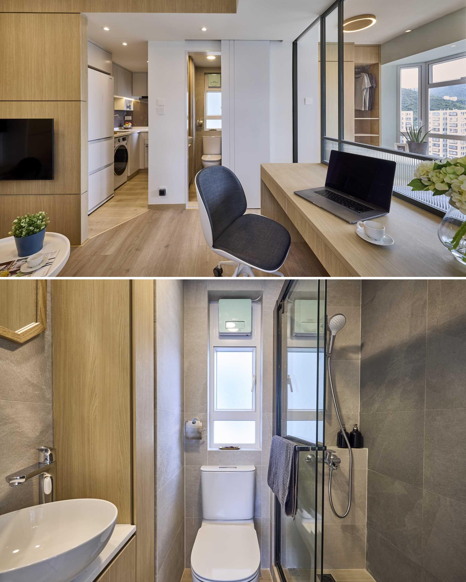 The bathroom in this small apartment is hidden behind a door that almost blends into the wall between the kitchen and bedroom. The small bathroom has a toilet, shower, a vanity area, a window, and a storage.