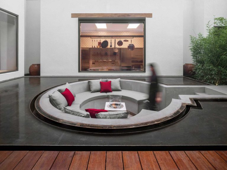 A Sunken Conversation Pit Surrounded By Water Is A Remarkable Feature In This House