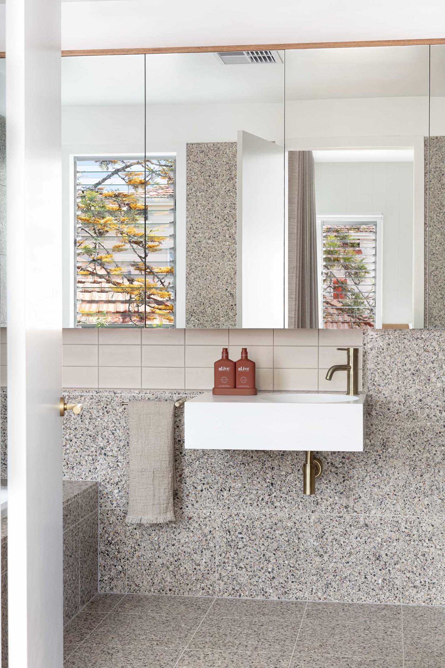 A modern bathroom with large format tiles.