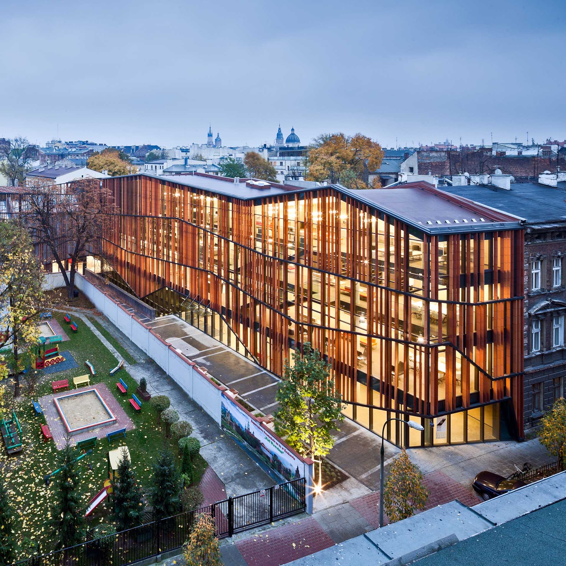 A modern building with a glass and wood facade.