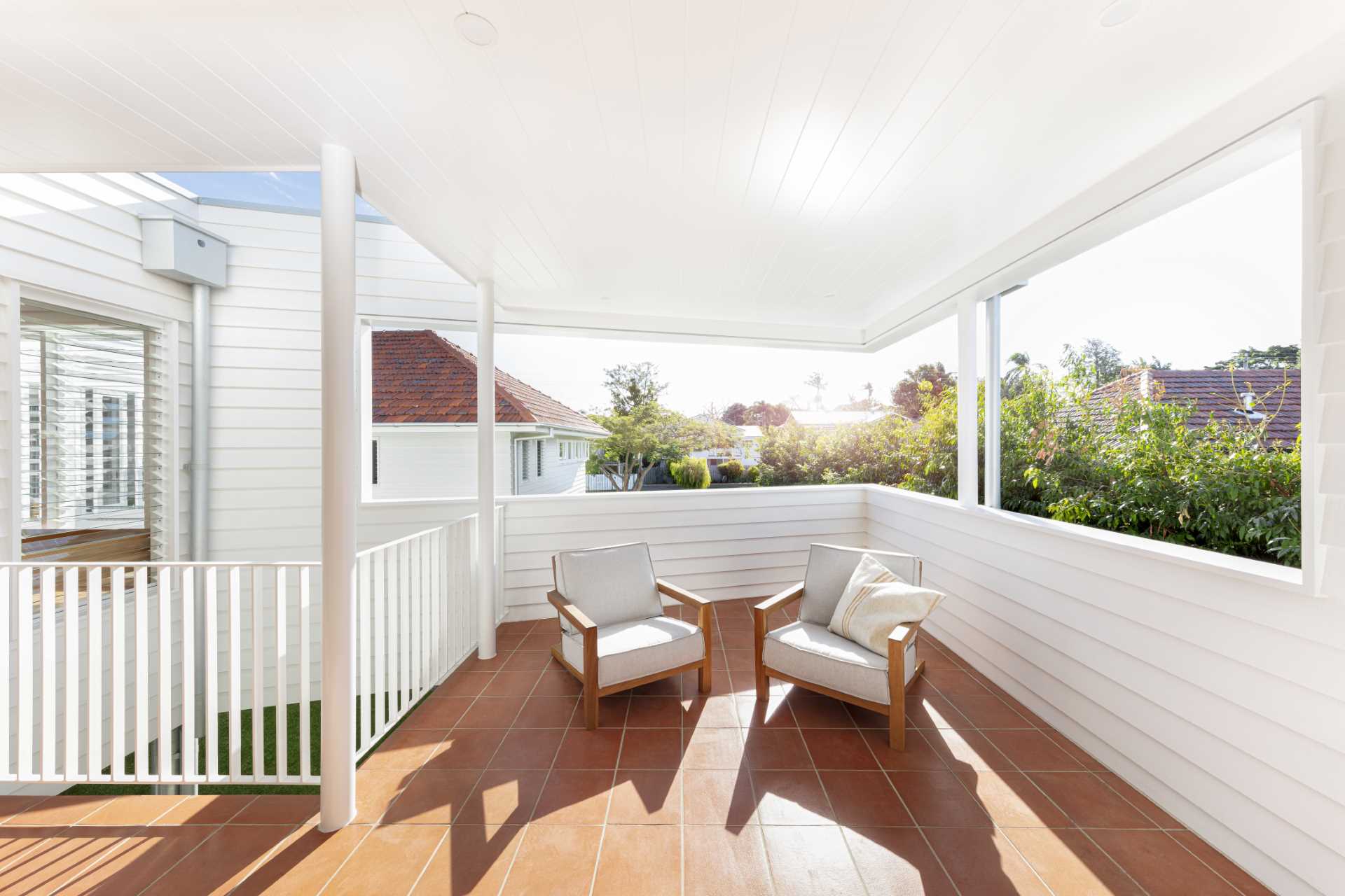 A covered deck increases the living area of this home.