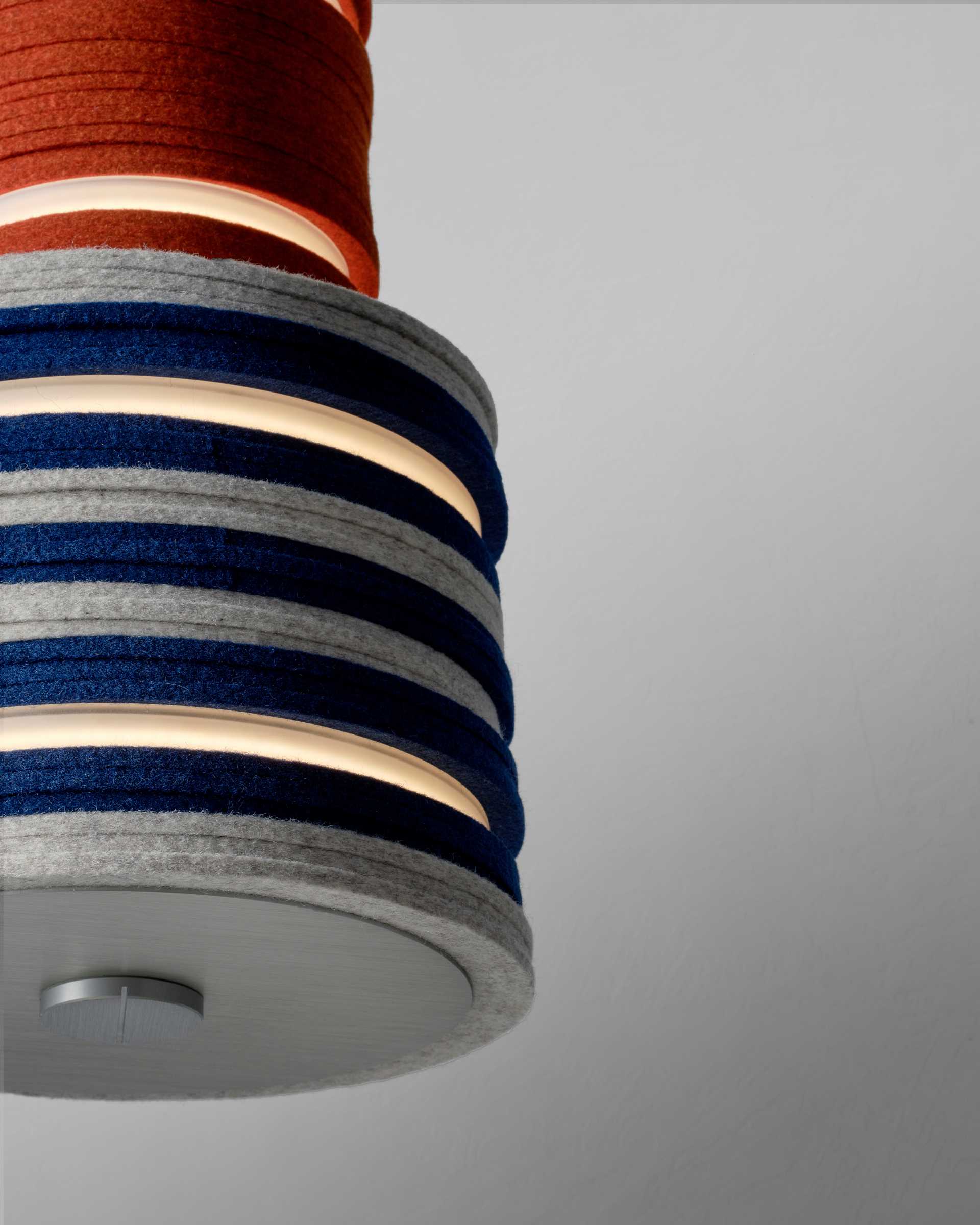 A modern lighting collection made from upcycled felt and aluminum, and energy-saving LEDs.