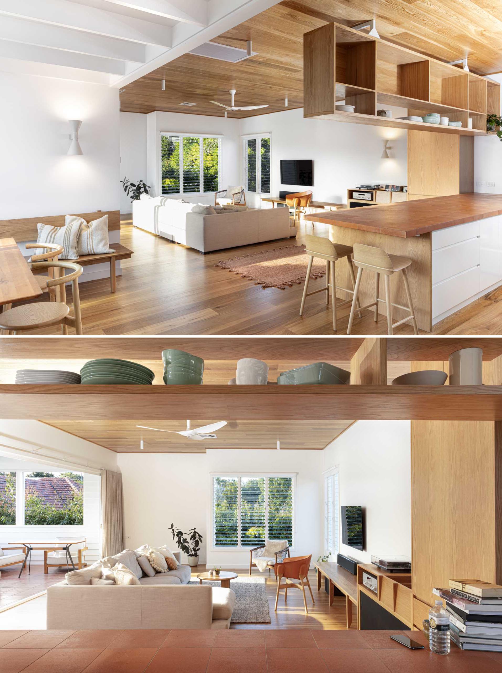 This living room includes a wood shelf under the TV, that transitions into a built-in DJ booth.