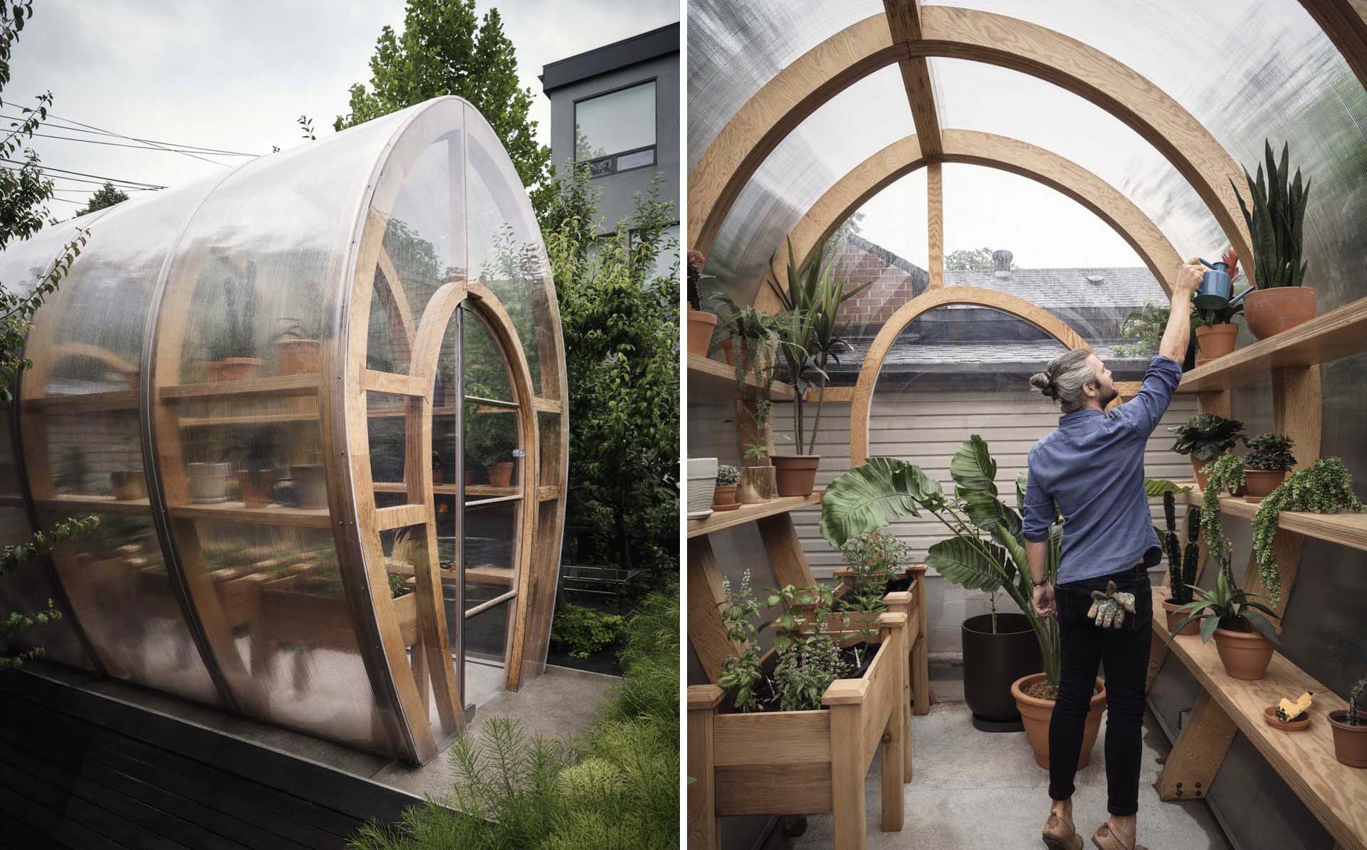 A backyard with a modern and modular greenhouse design.
