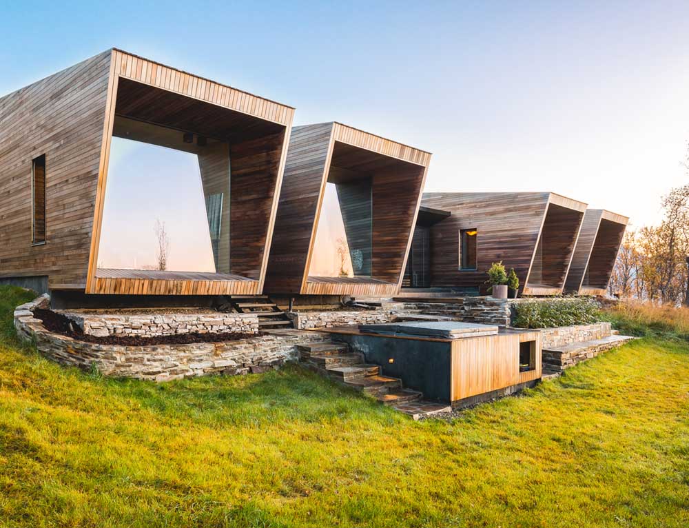 A collection of small and modern cabins with a wood facade.