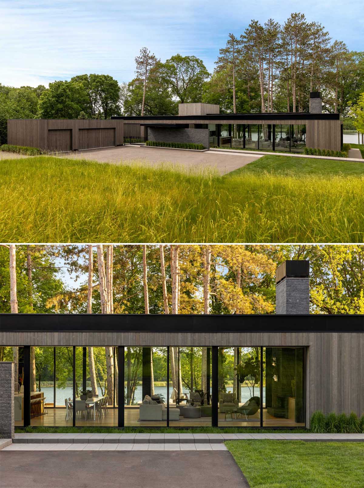 A modern house with glass walls and sliding doors.