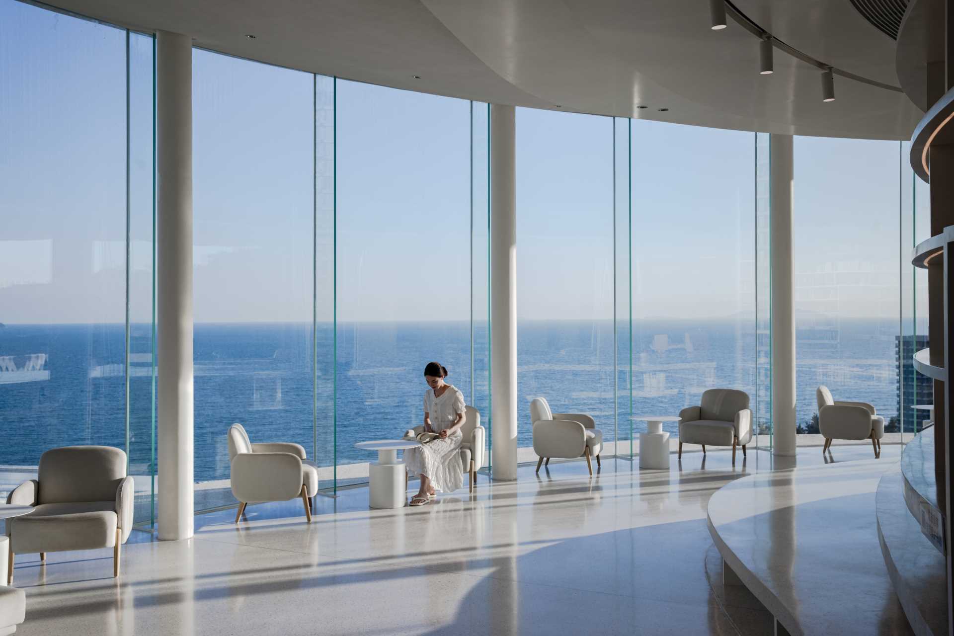 Floor to ceiling windows follow the curve of this building, and provide uninterrupted views of the water.