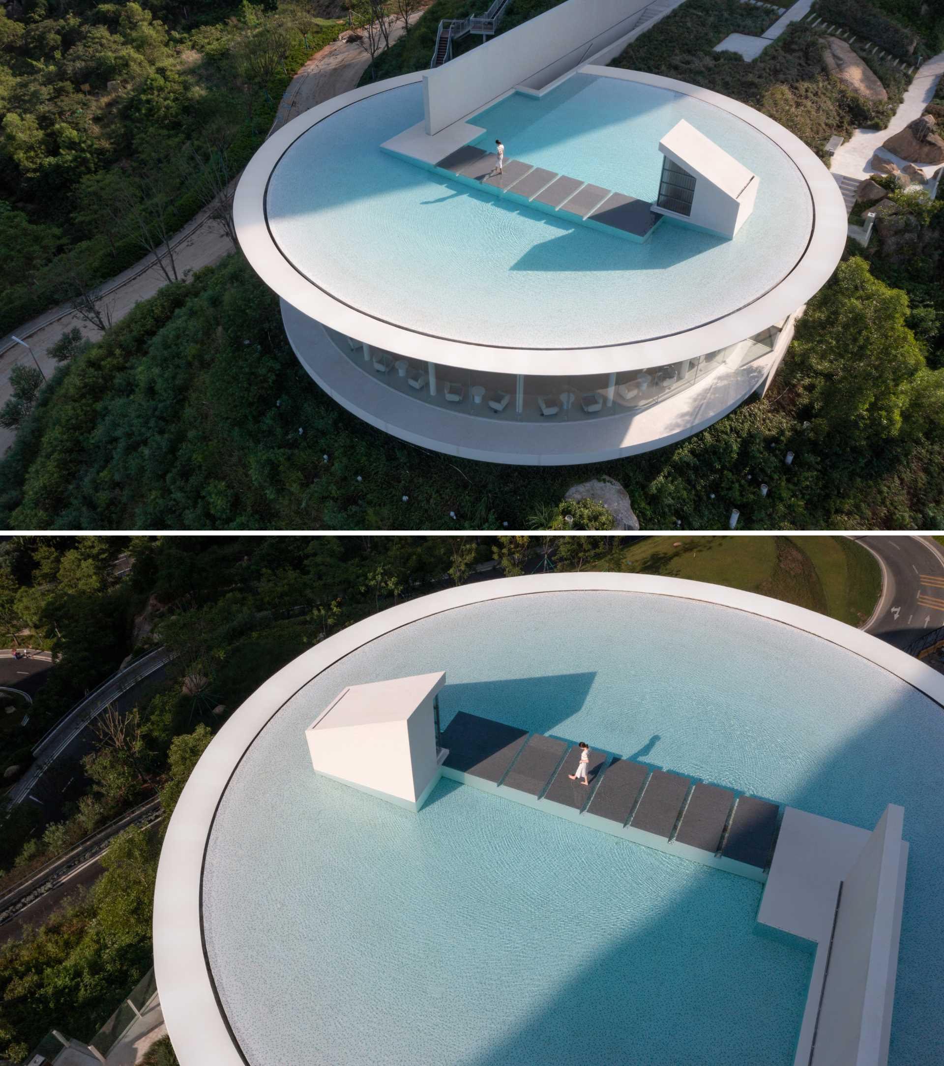 A platform located in the middle of the rooftop pool can be reached through the stepping stones that match with the water surface.