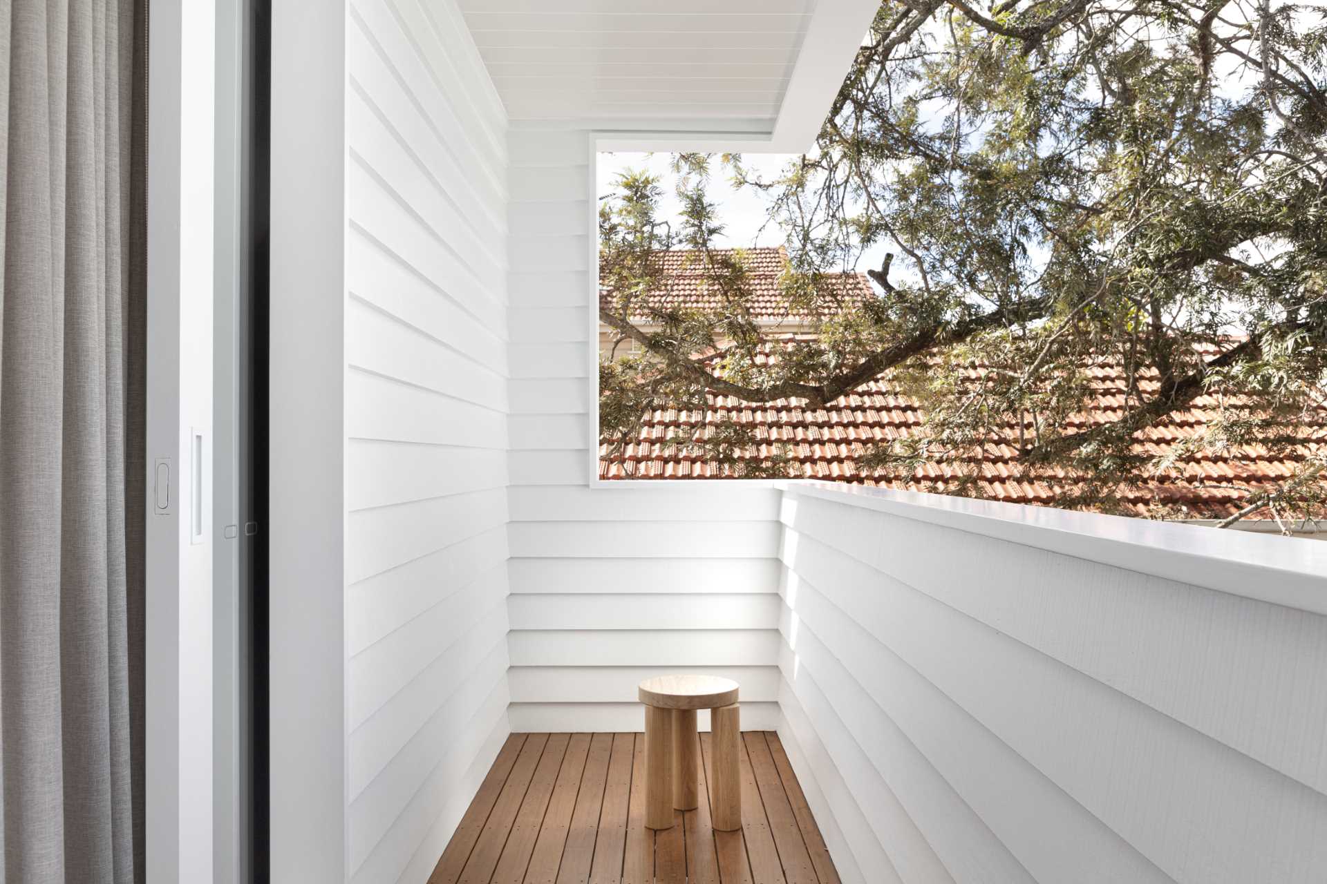 A small private balcony off a primary bedroom.