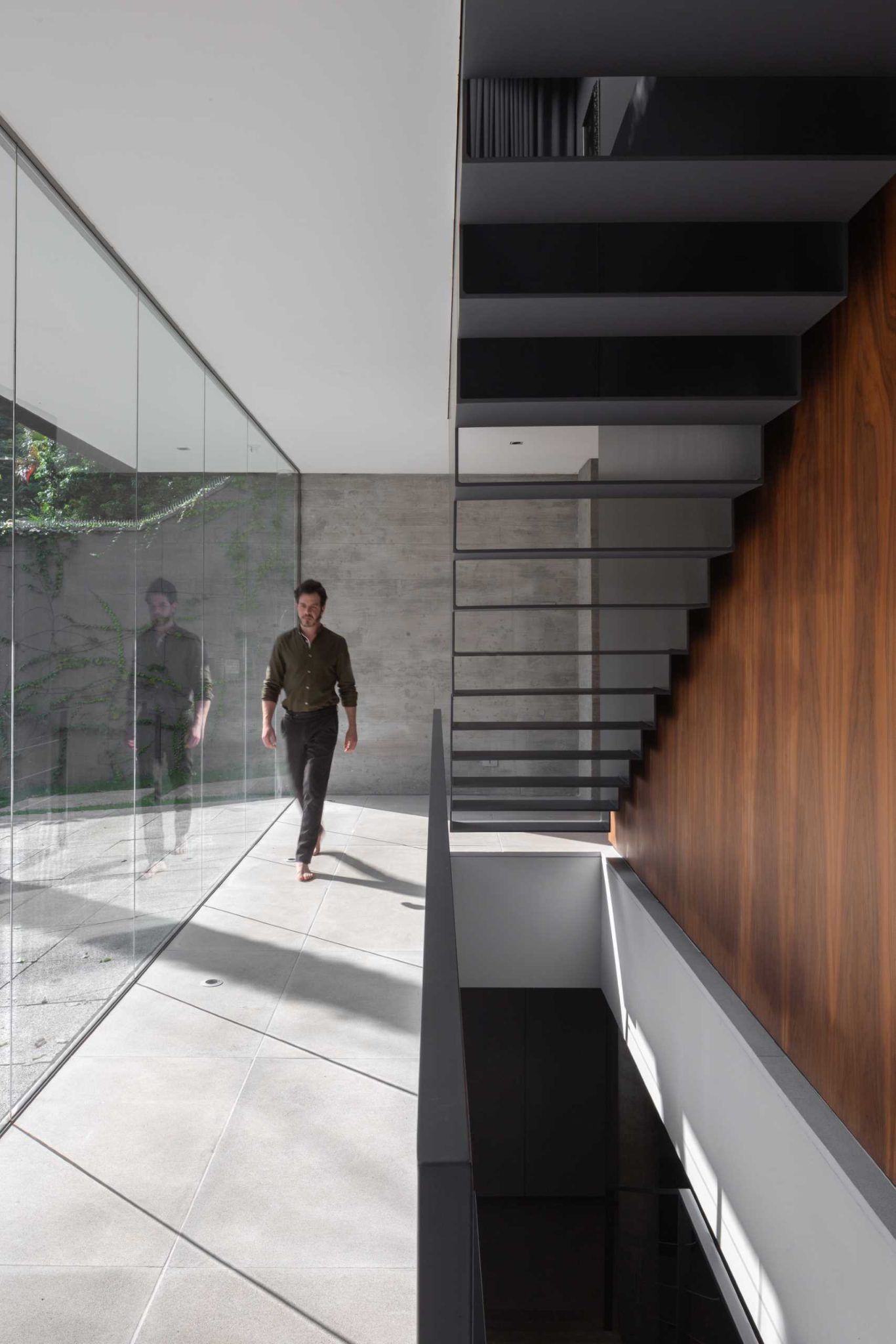 Oversized Metal Shutters Provide Privacy And Shade For This Modern Home