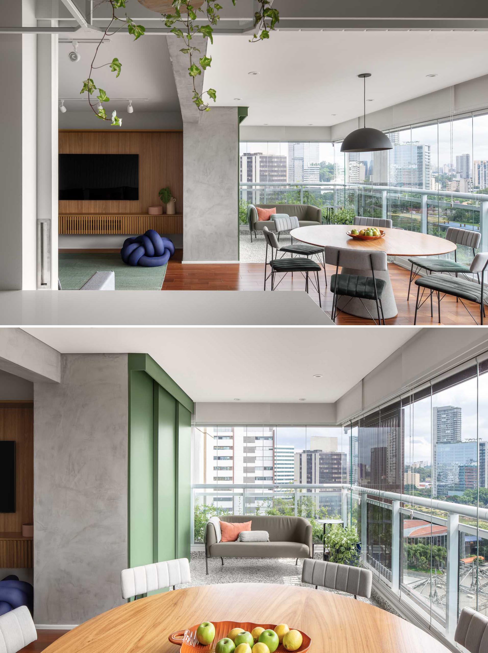 In this modern apartment, the living room is open to the dining area and a secondary lounge area. Both enjoy an abundance of natural light and uninterrupted views of the city.