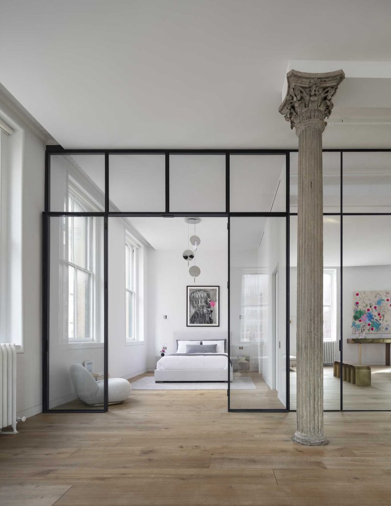 A Large Mirrored Wall Is A Prominent Feature Of This Apartment An
