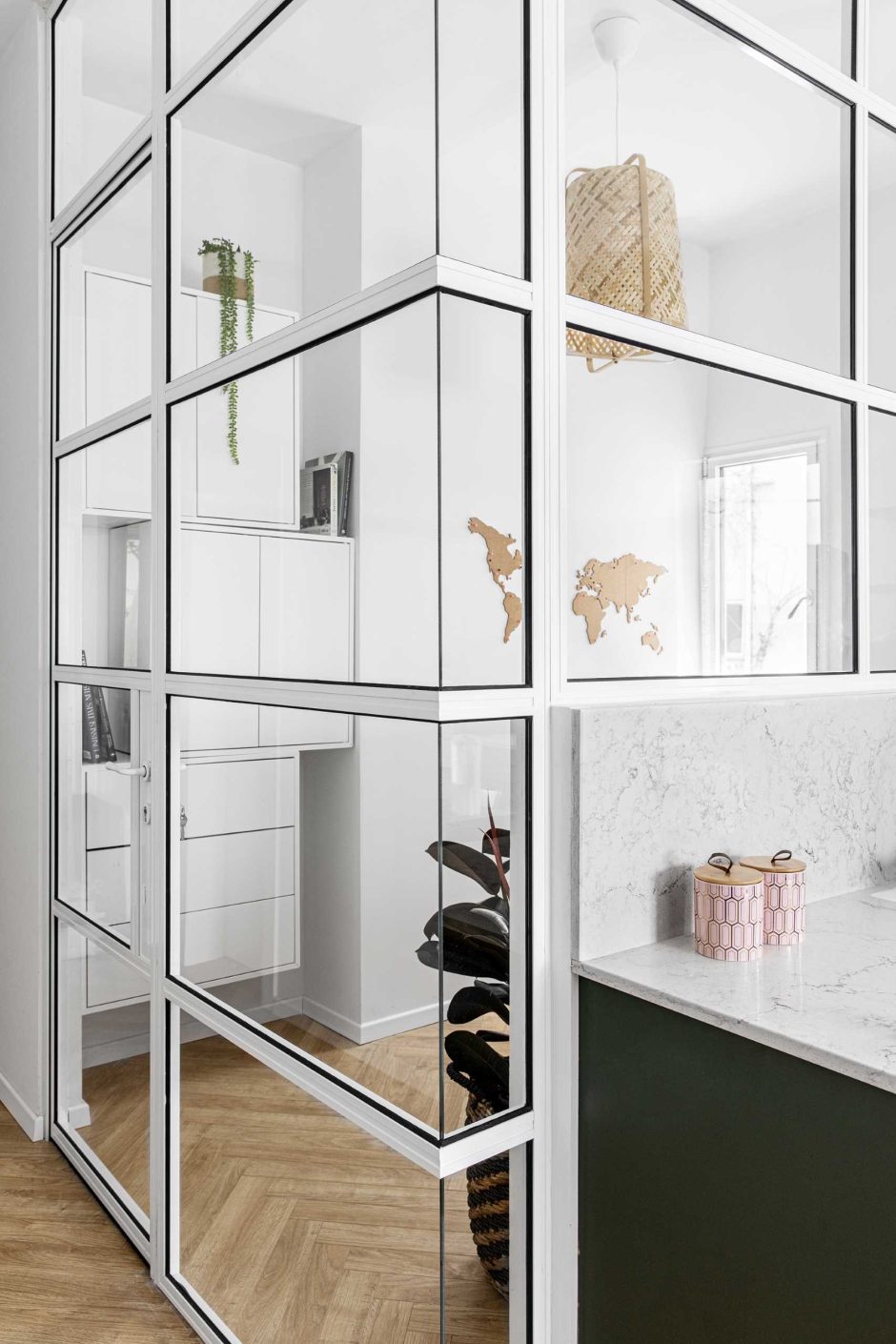 A Glass Enclosed Home Office Is Tucked In Behind The Kitchen In This