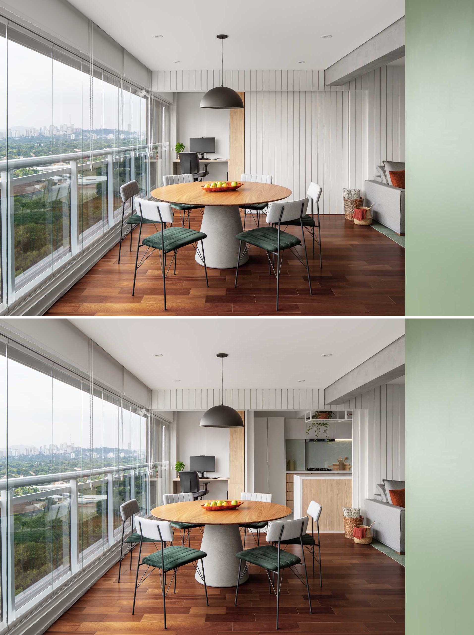 A wall in the dining room and living room opens to reveal the kitchen and home office.