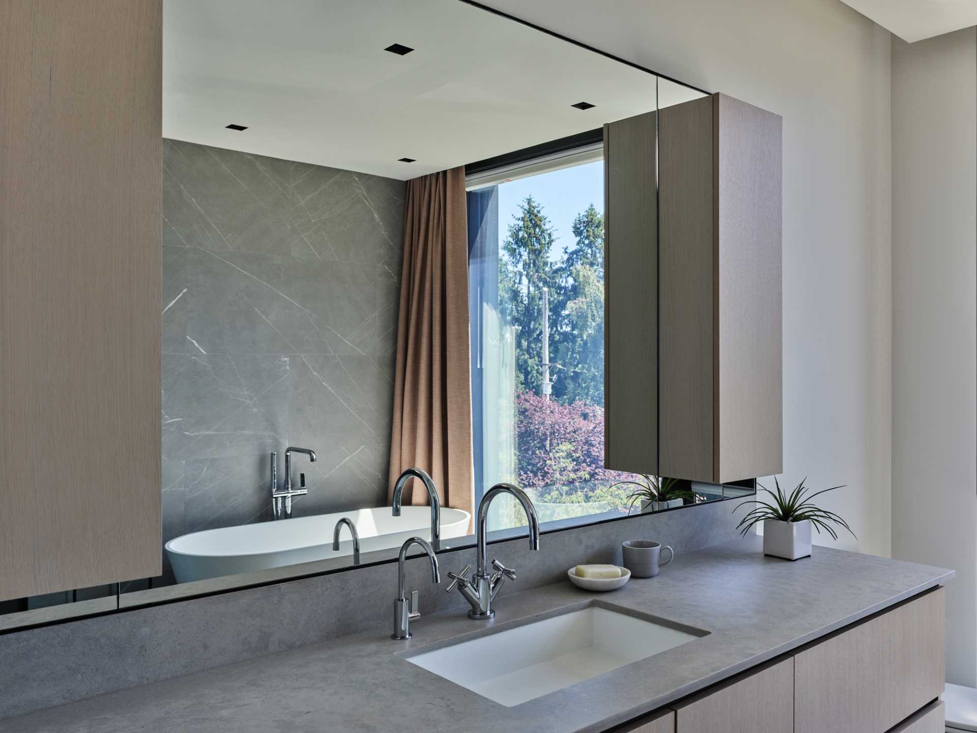 A modern bathroom with a freestanding bathtub.