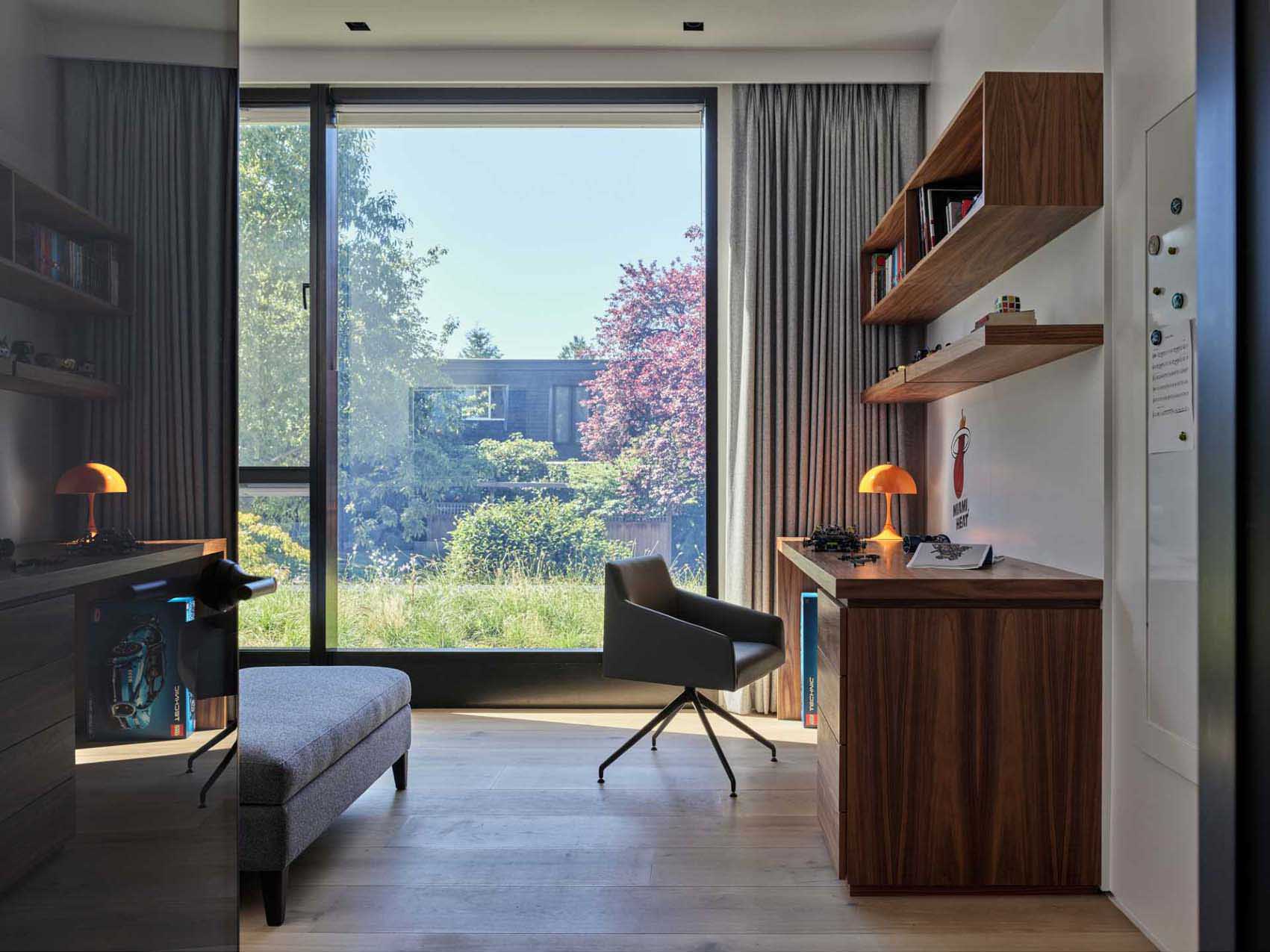 A modern bedroom with a study desk.