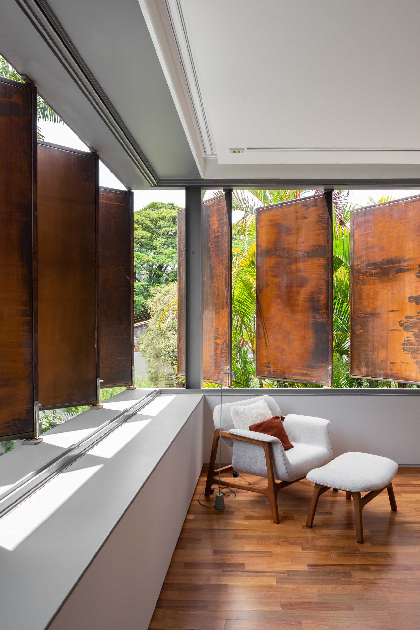 Large metal shutters provide privacy for the primary bedroom.