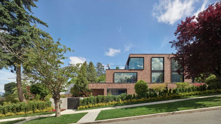 This Modern Brick House Terraces Down The Hillside