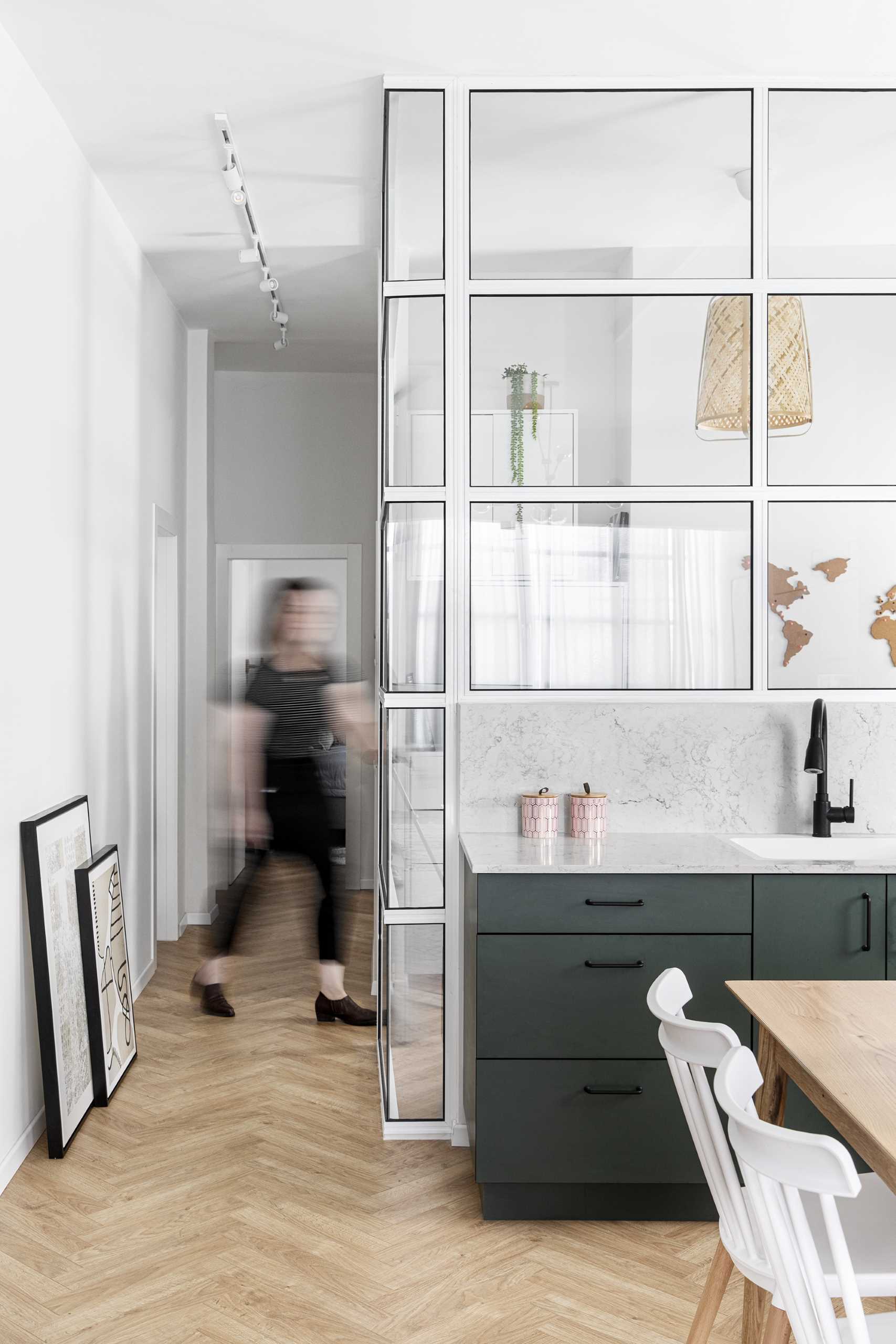 White-framed windows enclose a modern home office.