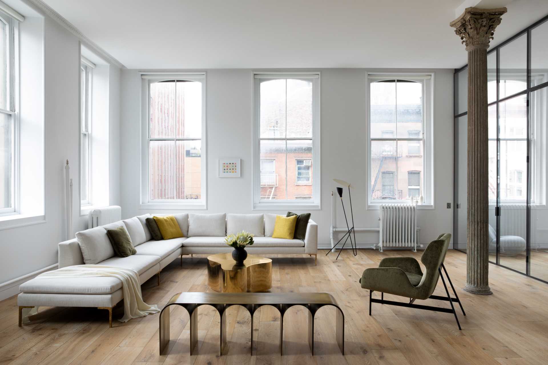 A modern living room with wide plan oak flooring.