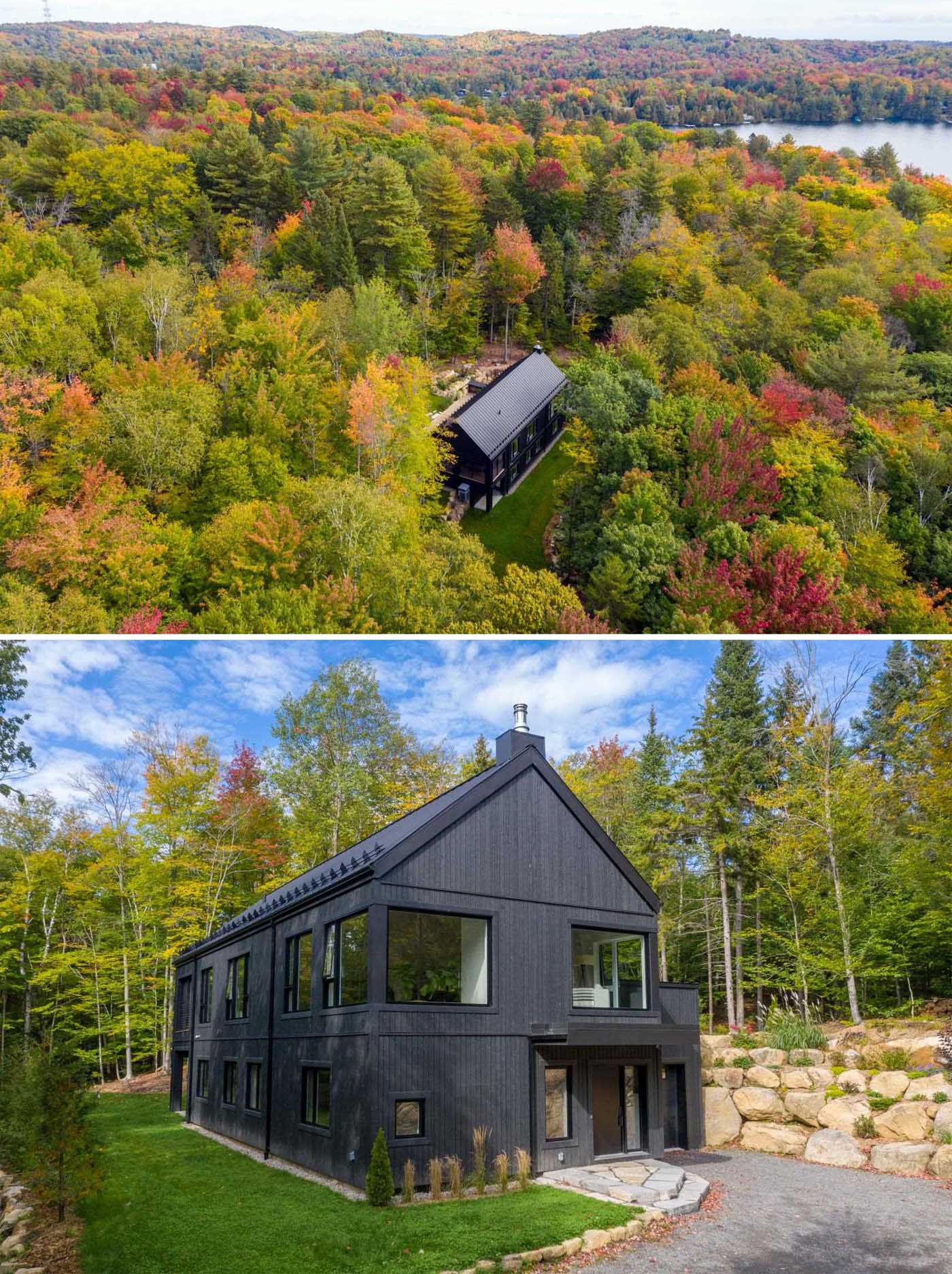 A modern home has a striking black metal and wood exterior.