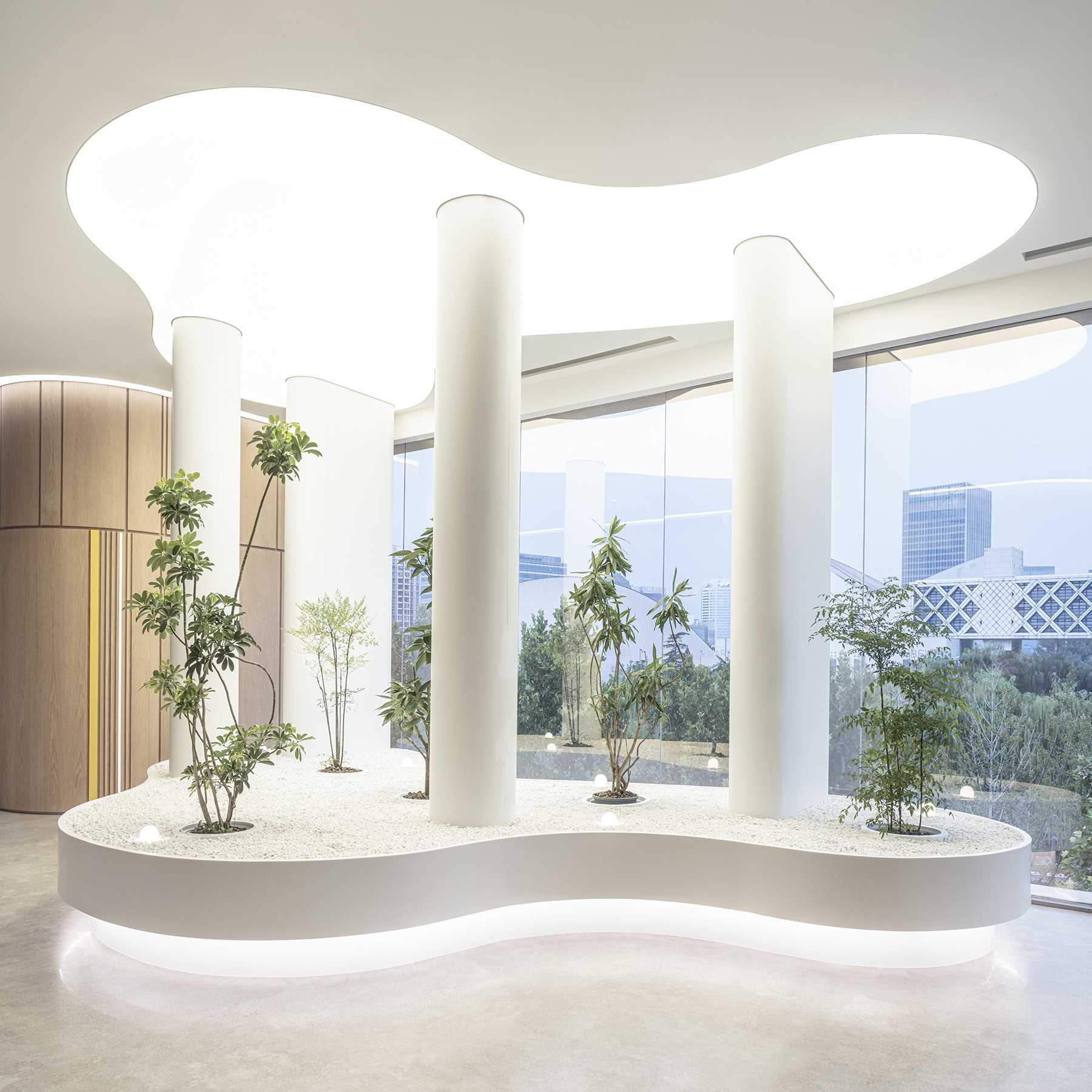 A golf lab includes this sculptural area with lighting and plants, that's reminiscent of bunkers, a hazard on the golf course.