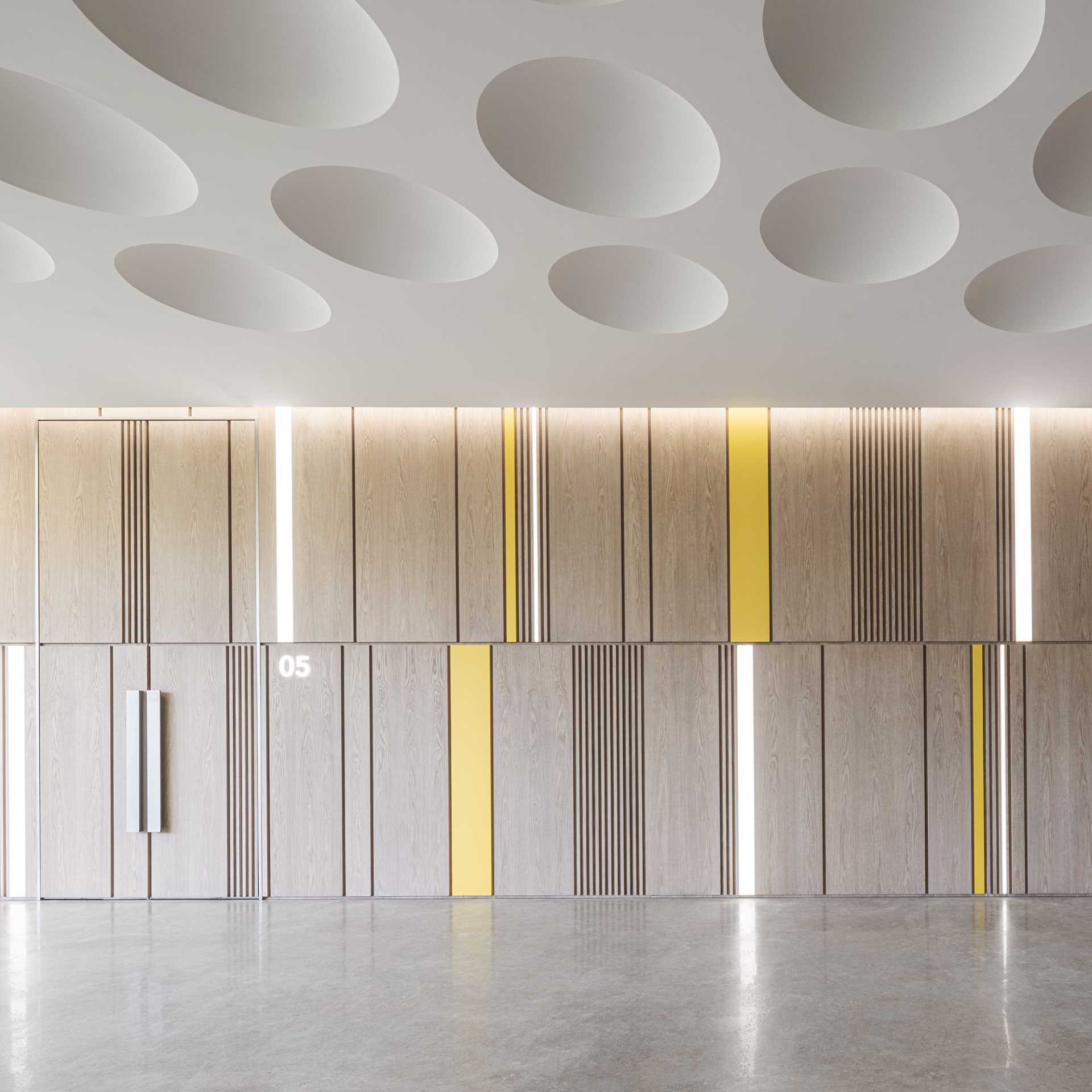 A modern and sculptural ceiling inspired by the dimples on a gold ball.