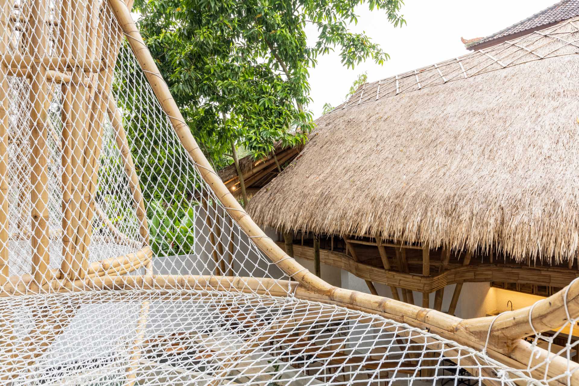 A relaxing hammock hangs off a balcony.