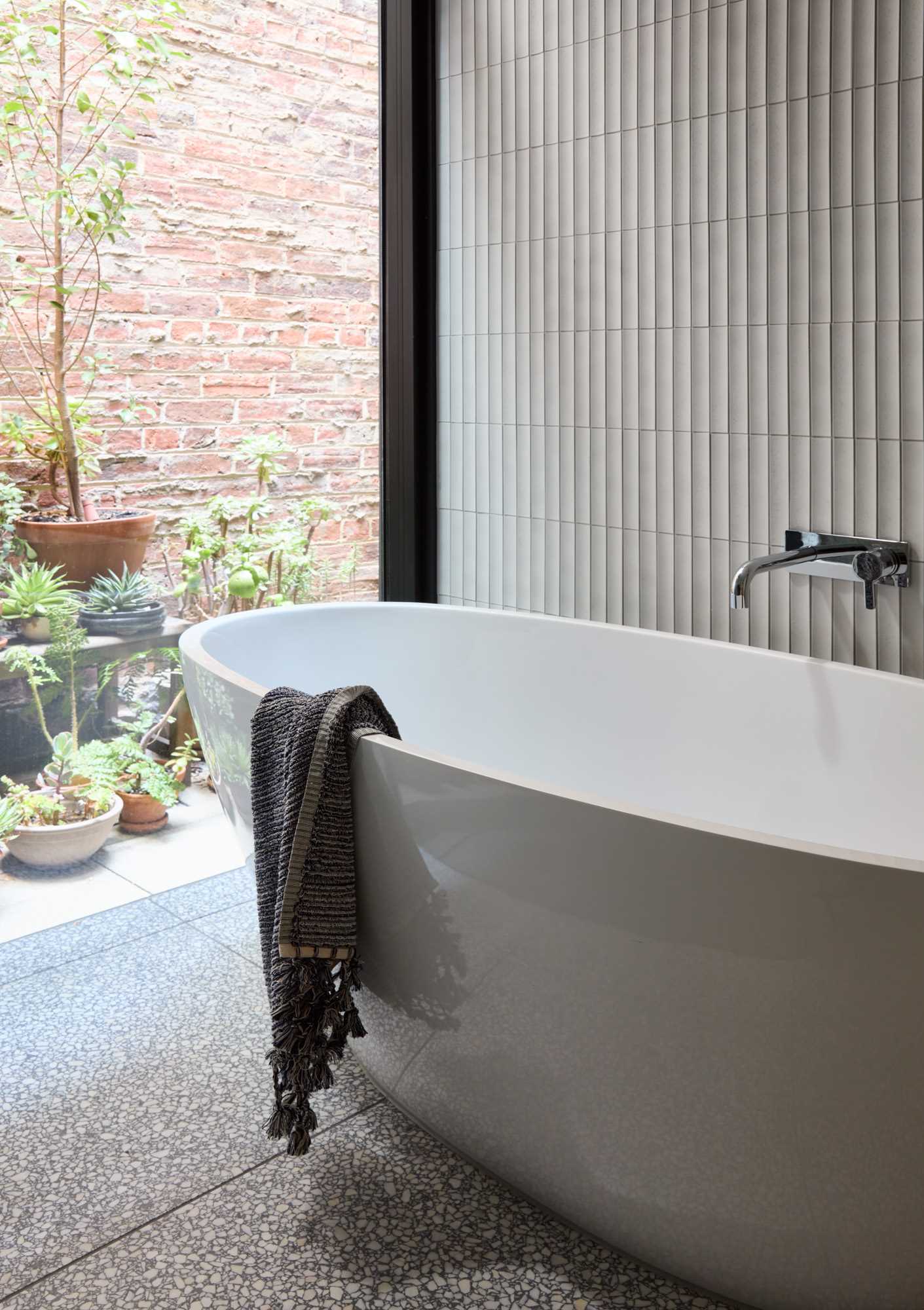 A modern bathroom with a free-standing bathtub.