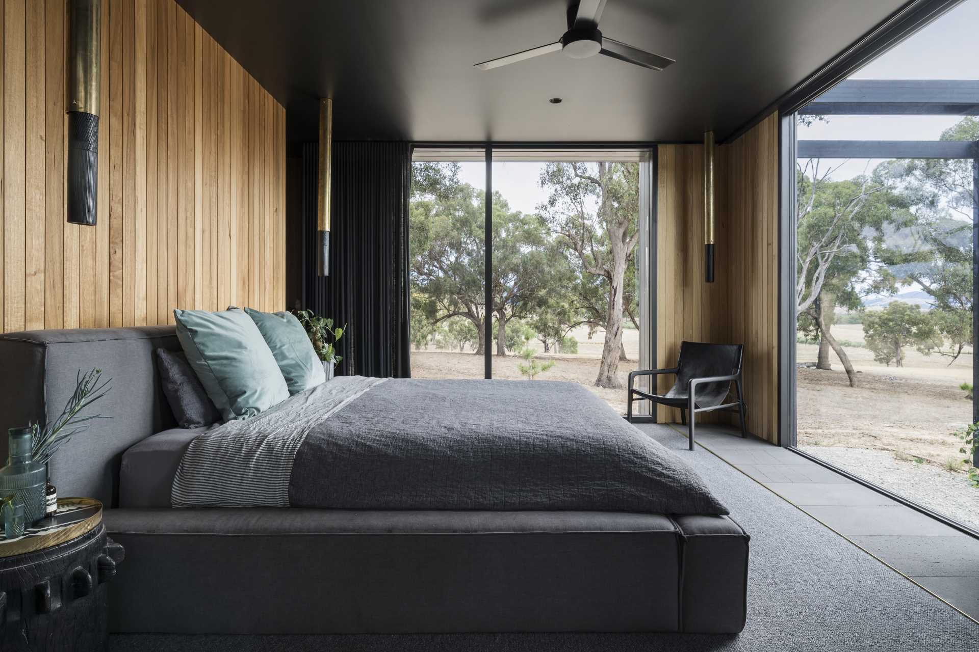 Tile flooring transitions to carpet in this bedroom for a softer feeling underfoot.