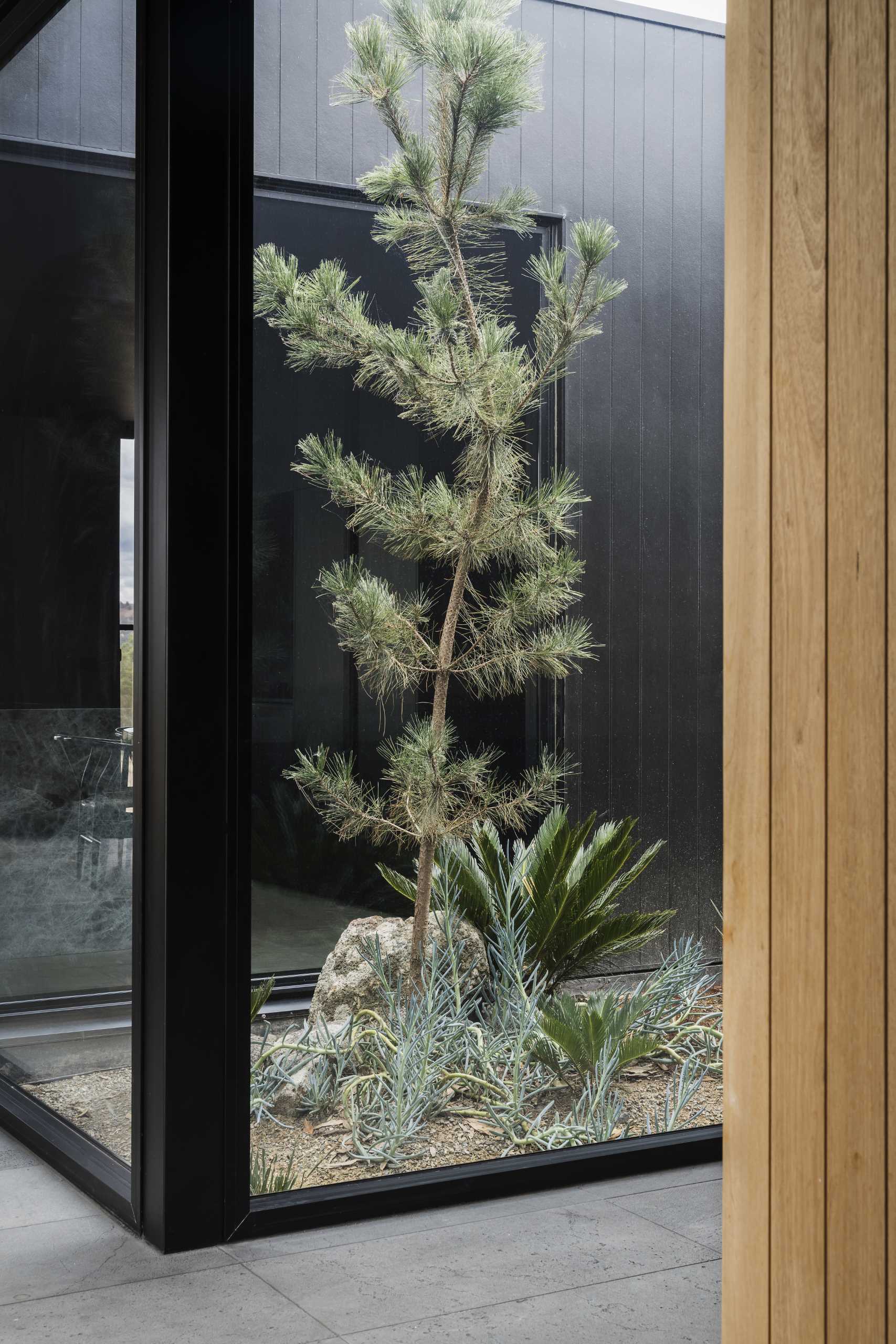 Windows located at optimal locations throughout this modern home provide uninterrupted views of the landscape.