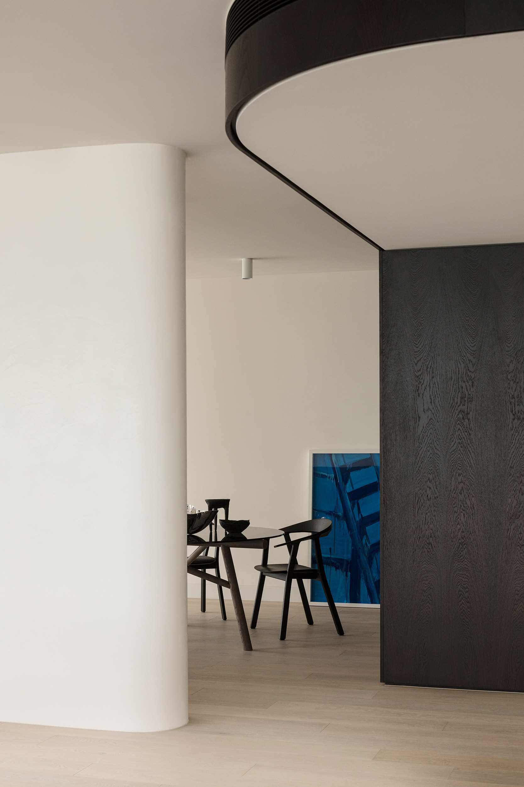 This modern dining area is partially obscured, creating a semi-private dining experience.