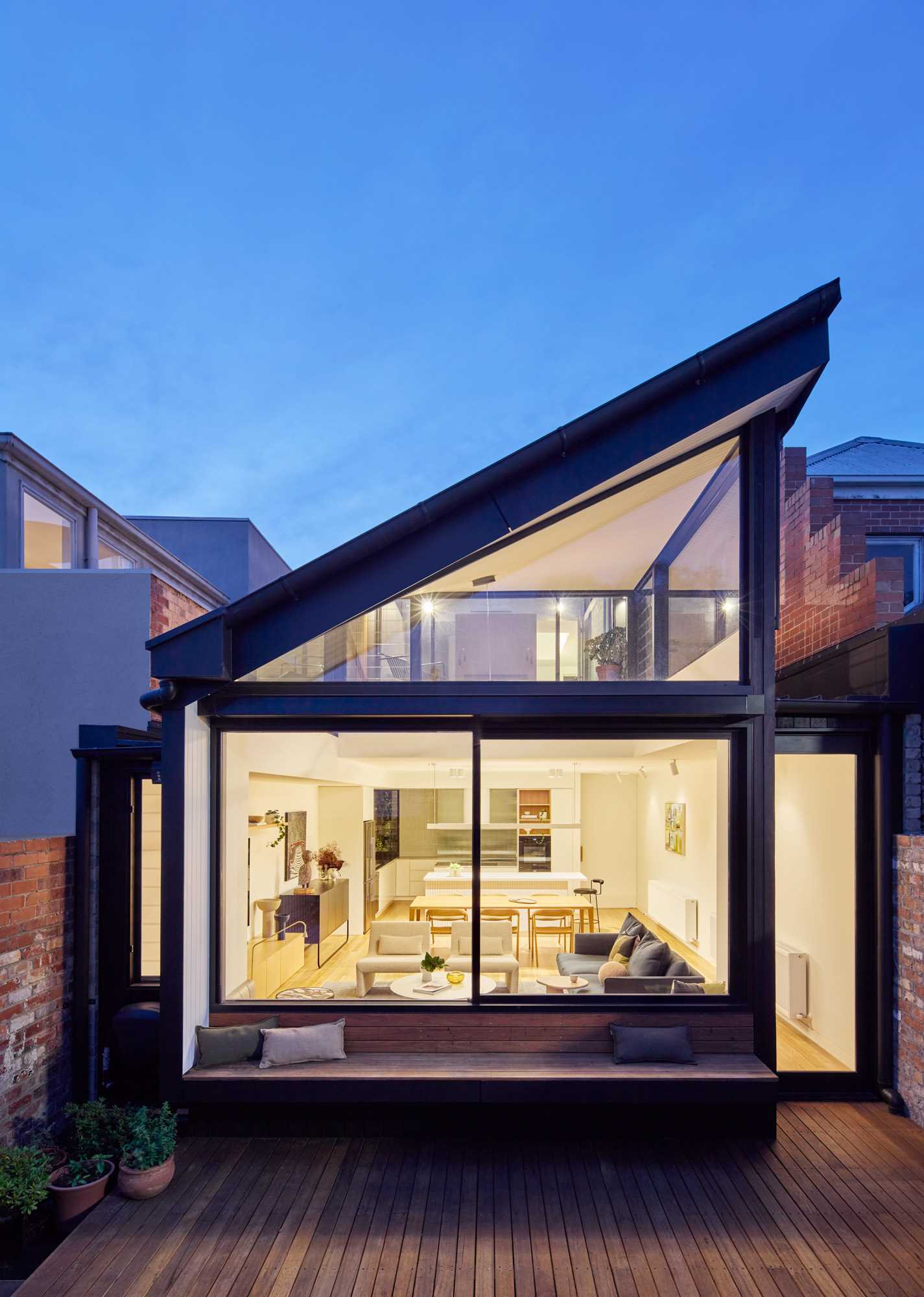 A modern house extension includes a built-in bench.