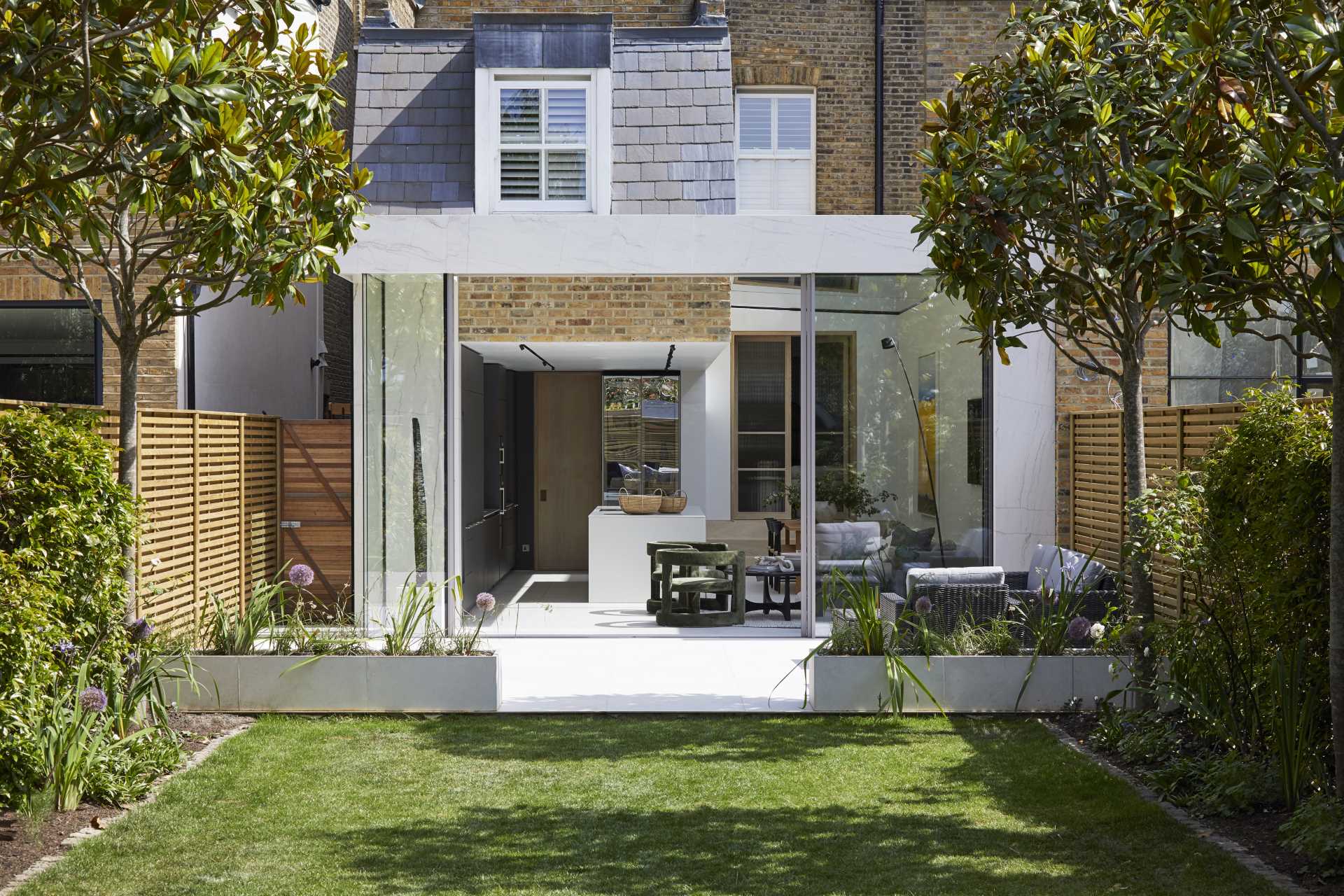 A modern extension with a large skylight that adds natural light to the kitchen, dining area, and living room.