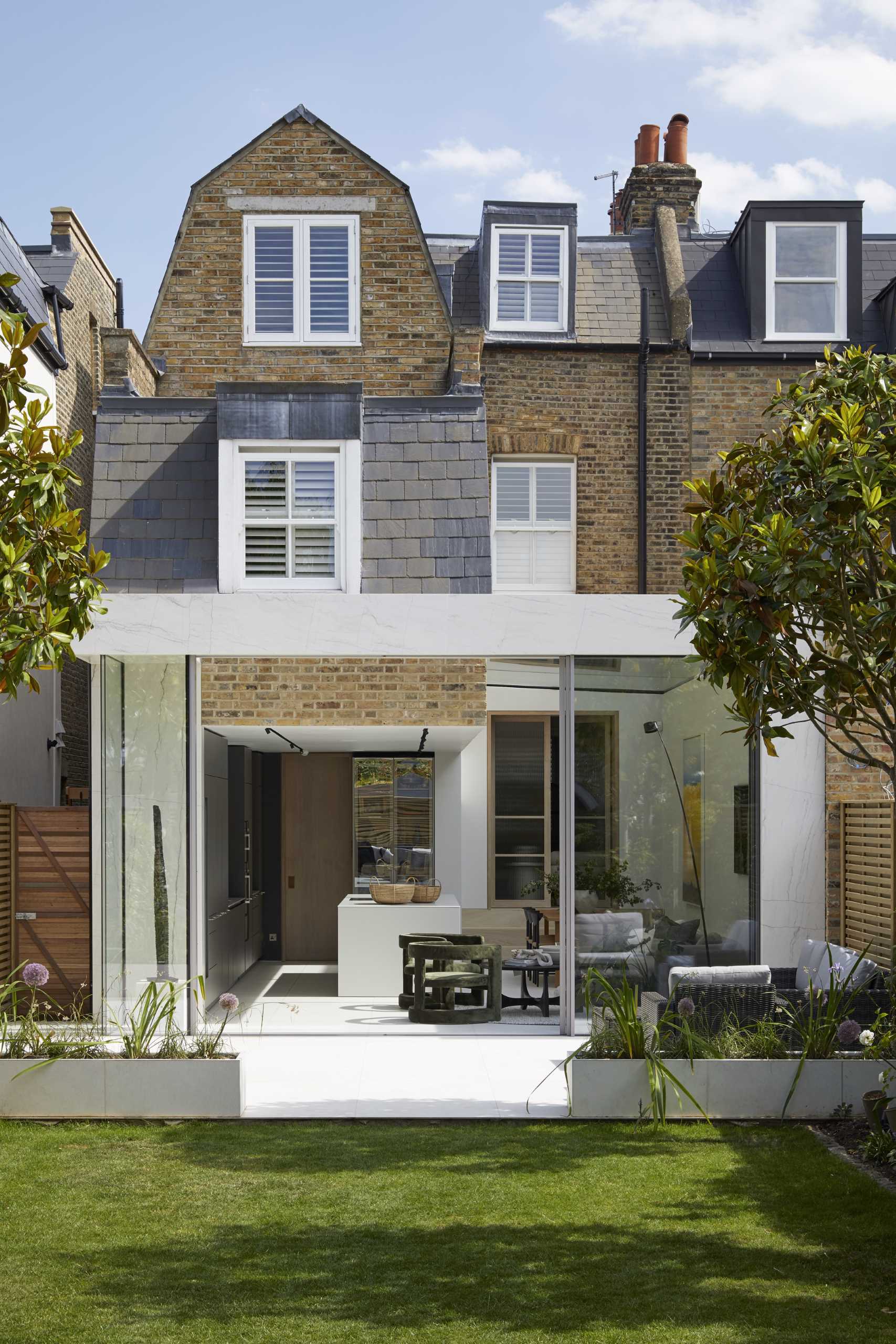 A modern extension with a large skylight that adds natural light to the kitchen, dining area, and living room.