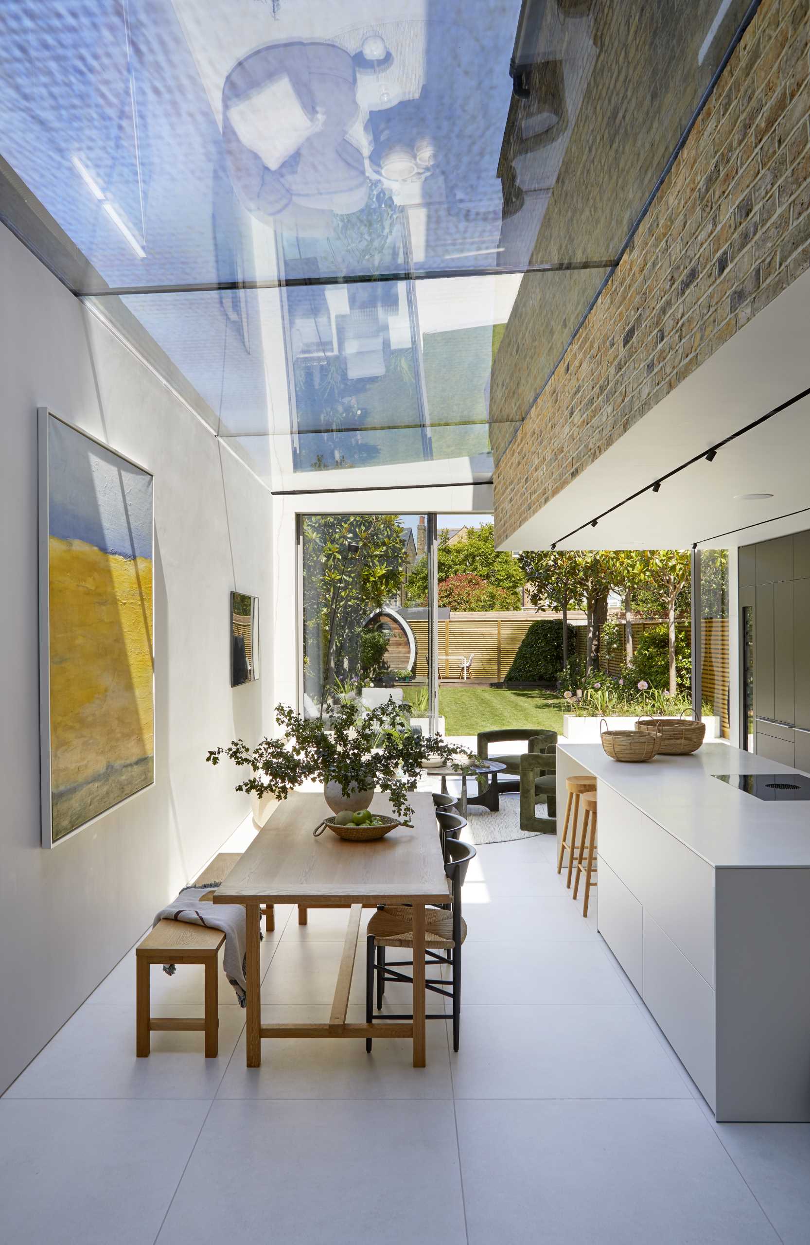 A modern extension has a large skylight above the dining area.