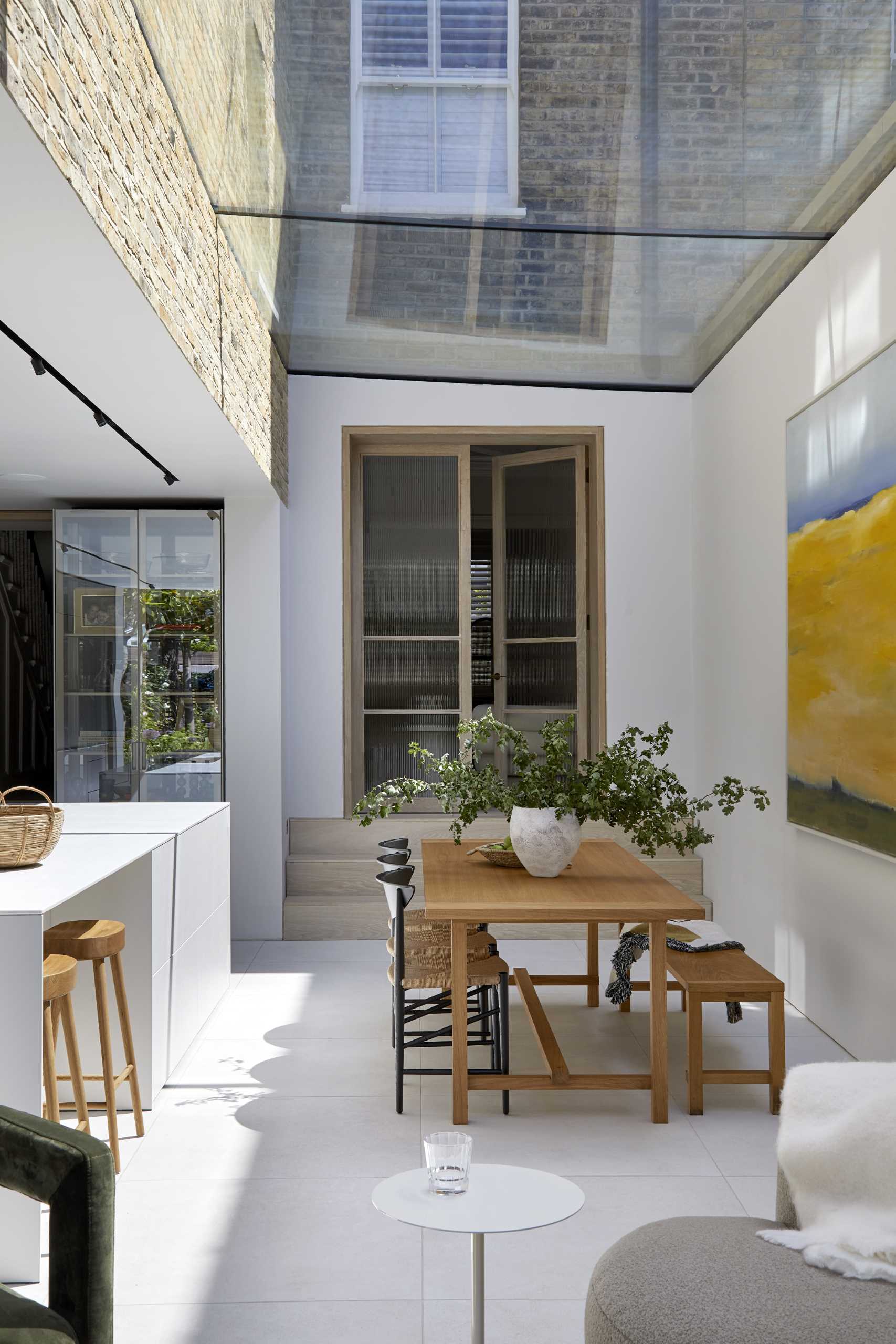 A modern extension has a large skylight above the dining area.