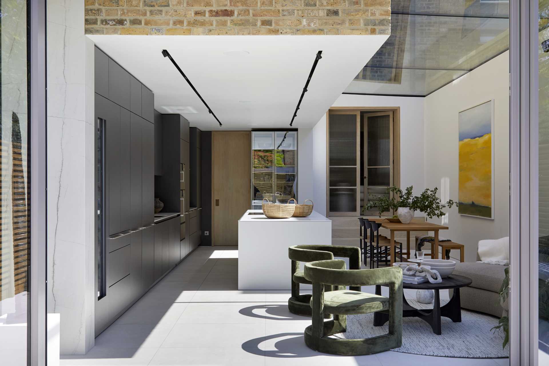 A modern extension with a large skylight that adds natural light to the kitchen, dining area, and living room.