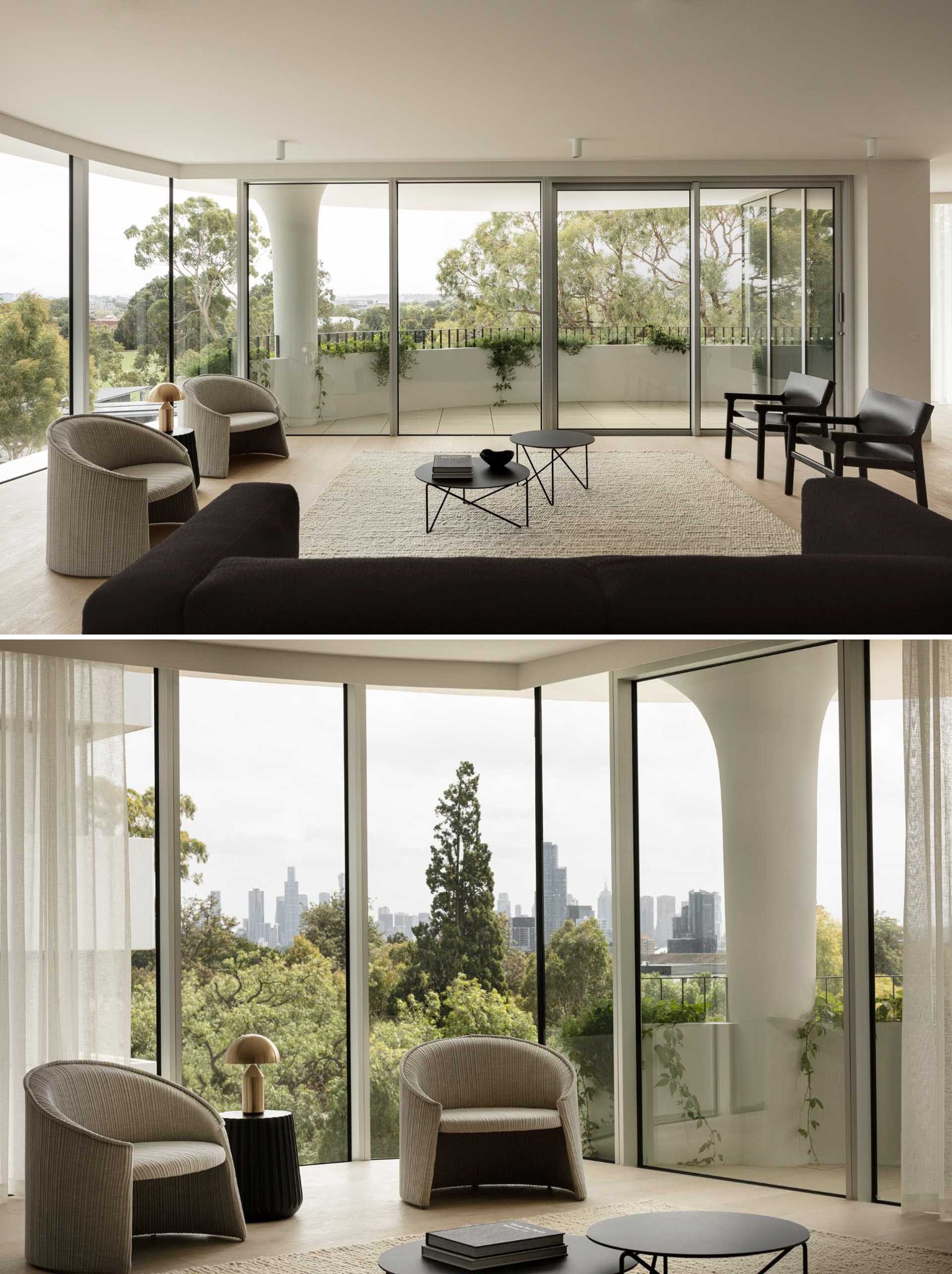 A modern apartment includes floor-to-ceiling windows, a curved terrace, a view of the structural fluted columns.