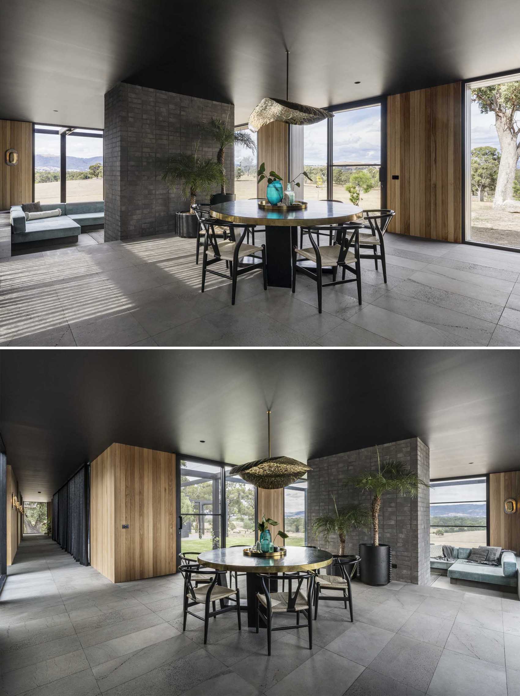 The dining room is central to the open social areas of this modern home, with a round table and a sculptural brass light fixture above.