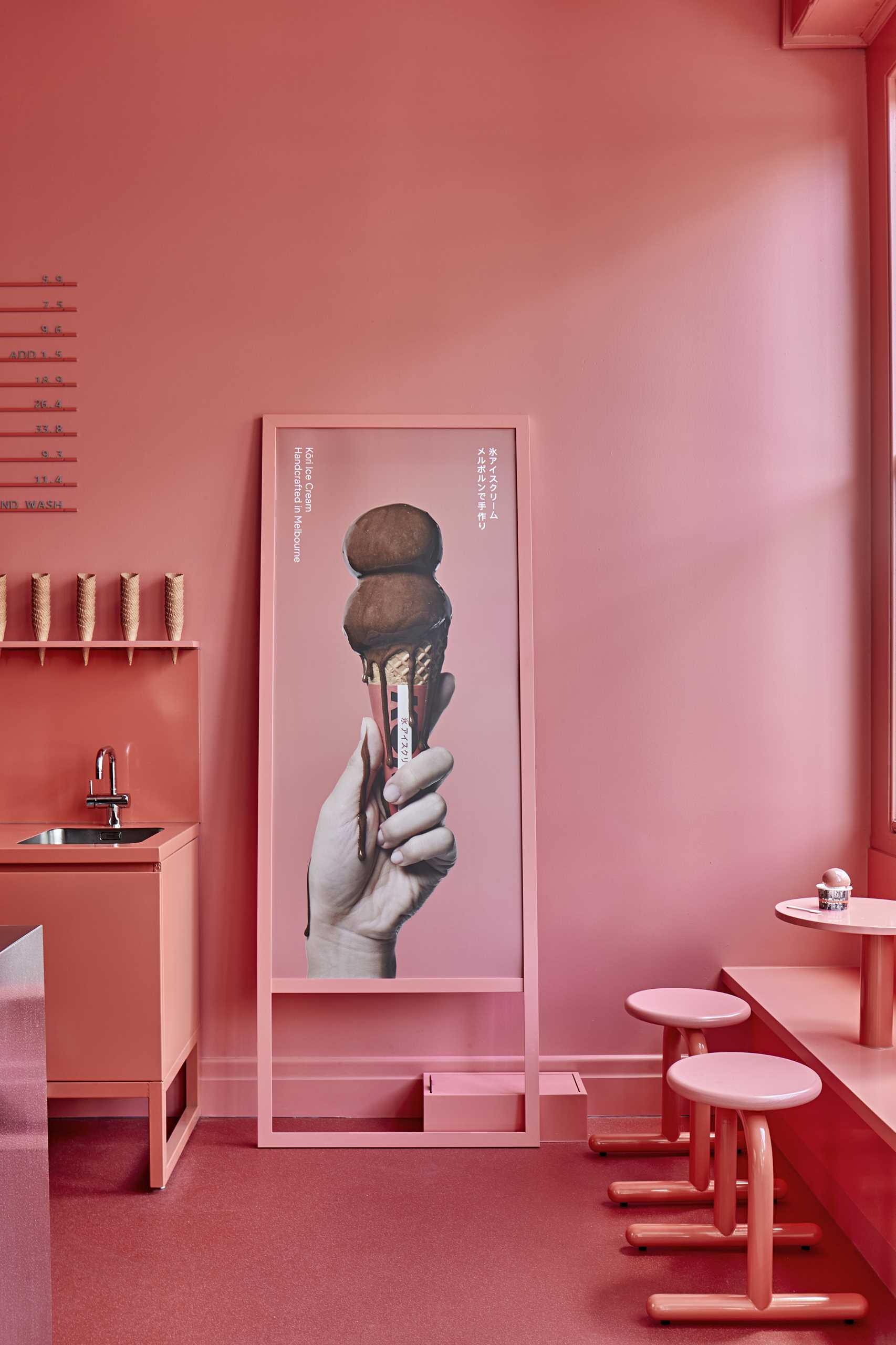 A modern ice cream shop with a matte pink and white interior.