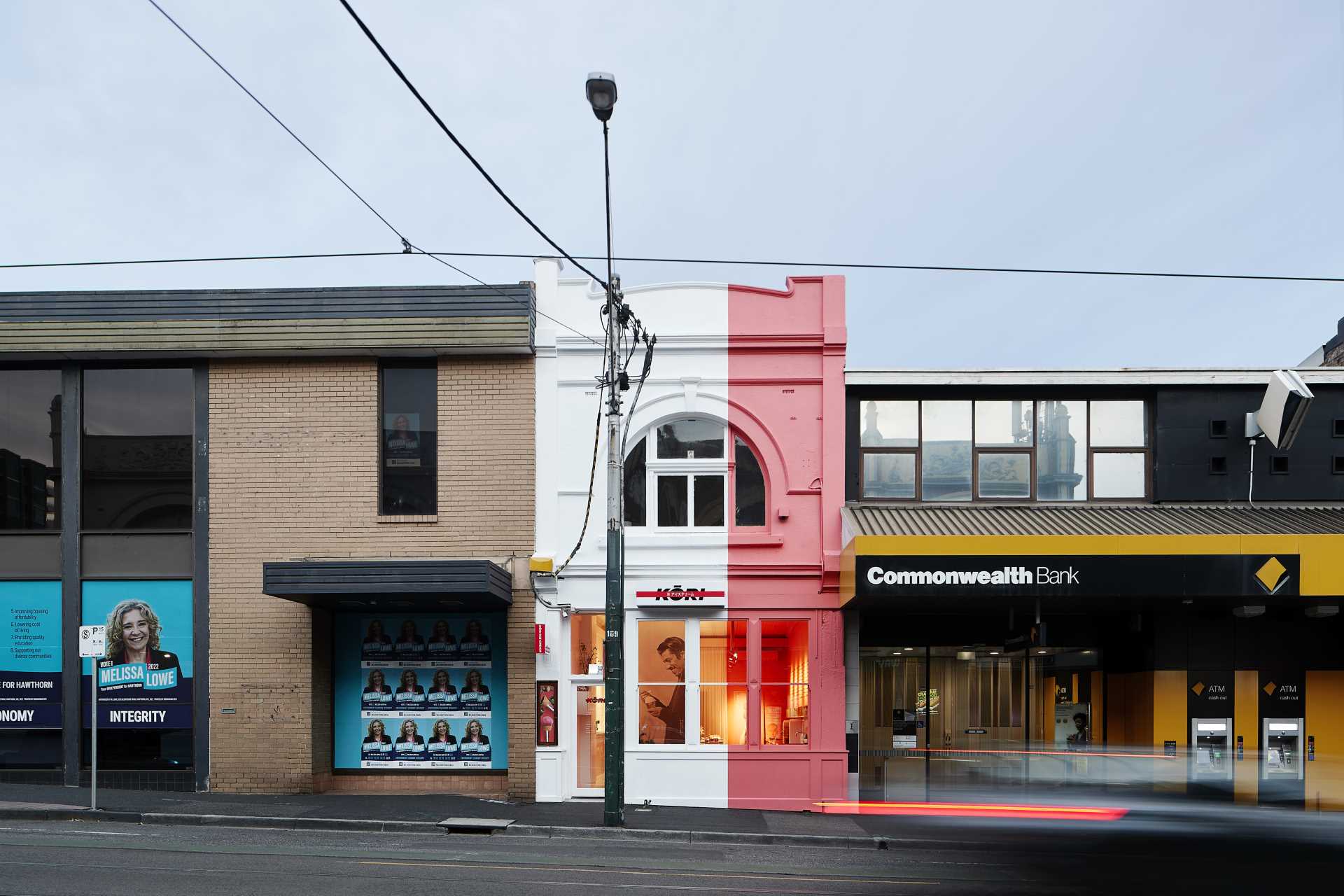 A pink and white ice cream shop exterior.