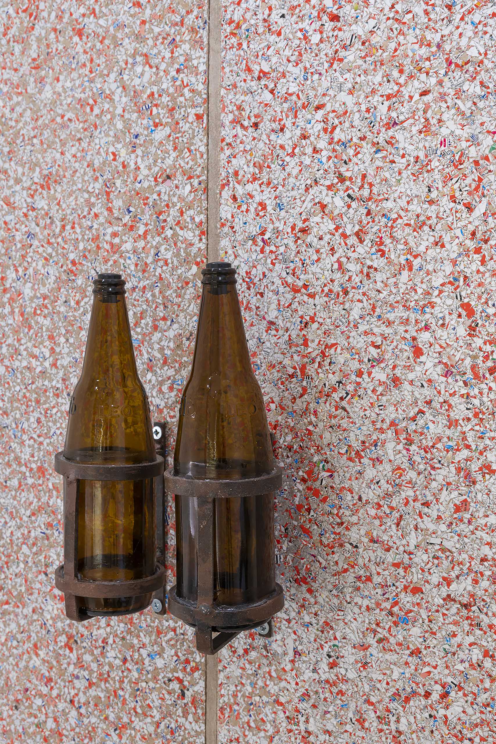 Recycled beer bottles are used as door handles.