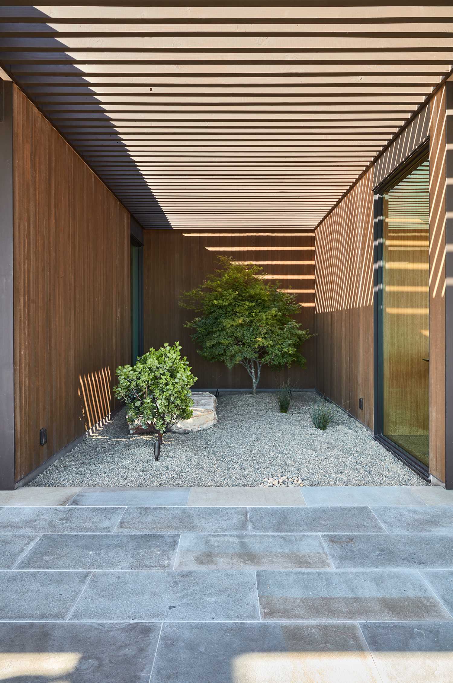 A small landscaped garden between two different areas of the house.