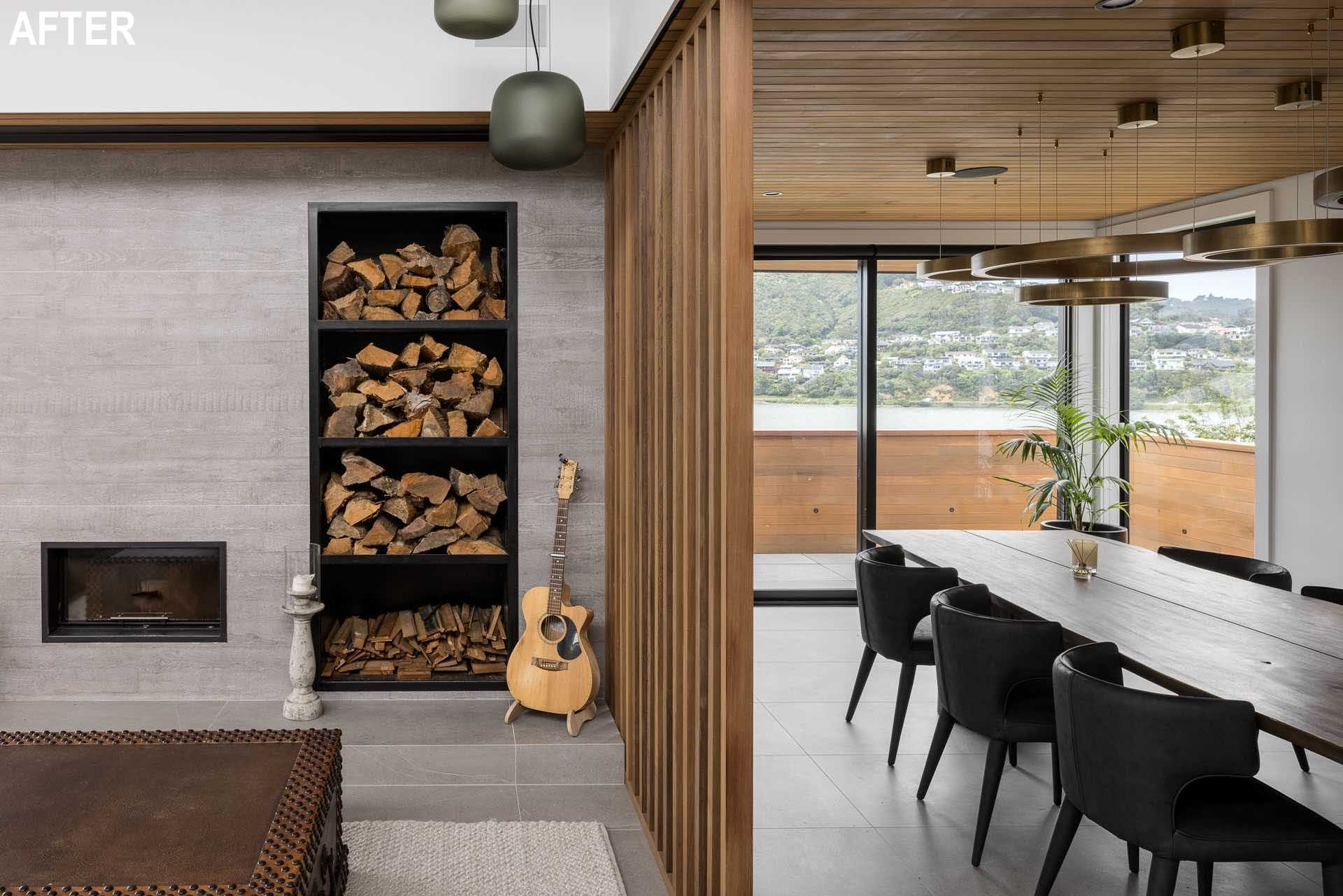 A modern dining room with a wood ceiling has water views.