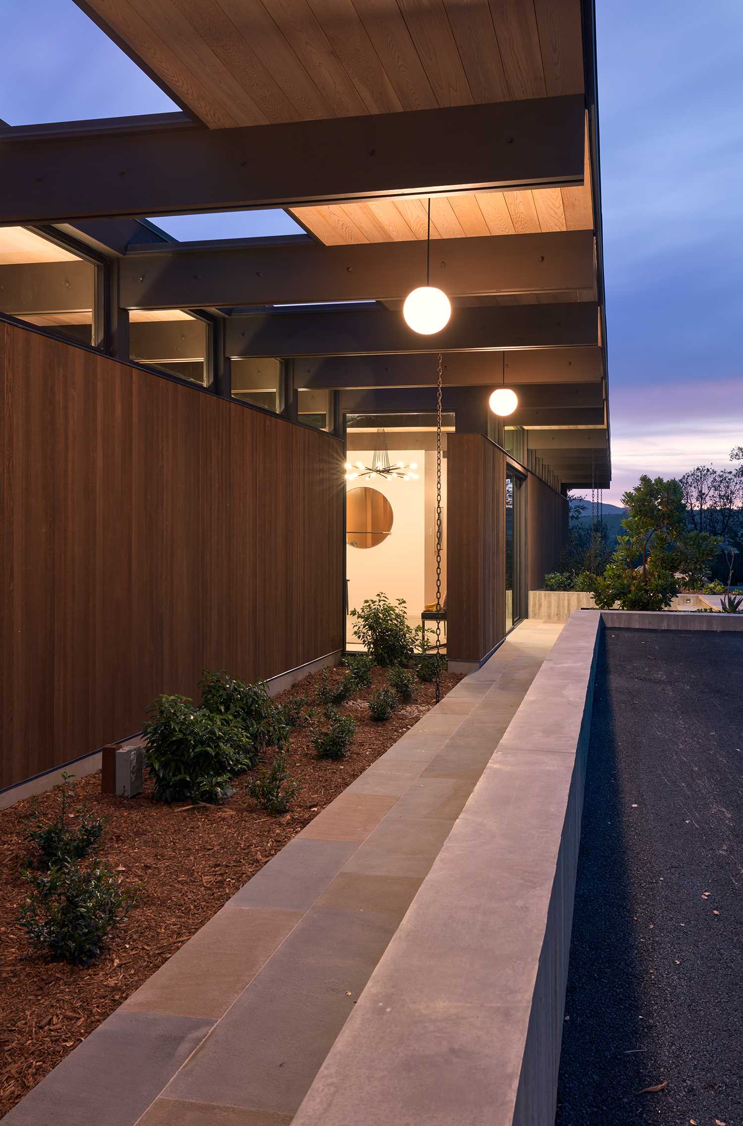 A new home inspired by mid-century modern houses with post and beam architecture.