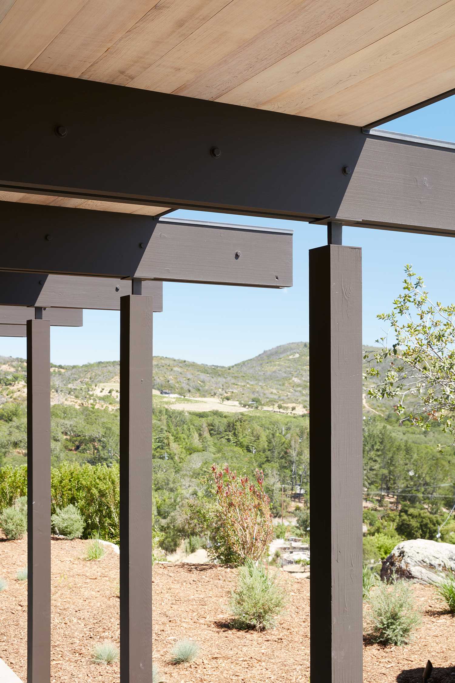 The post and beam structure of a new home, whose design was inspired by mid-century modern houses.